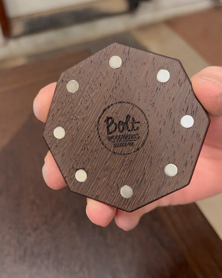 Cord managment features on the wenge desk.