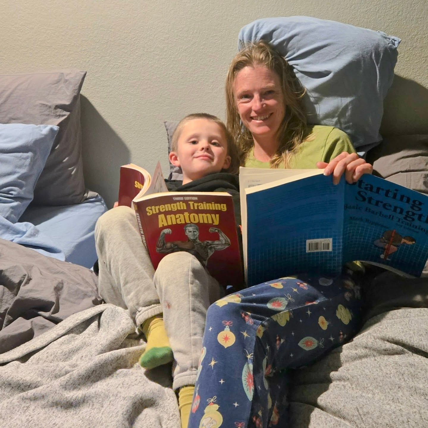 Like mother, like son? I have been revisiting my knowledge in the strength and conditioning space with the eventual goal in obtaining my CSCS (certified strength and conditioning specialist). Last night before bed I was reading the Starting Strength book and Strength Training Anatomy, and my son started looking at the anatomy book and was super interested in the muscles and all of the different strength movements. He spent close to 30 minutes looking through the book.
He has also been wanting to do "workouts" with me. Maybe a future athlete? It really goes to show that our kids are constantly watching us and observing what we are doing, so be a good role model!
#startingstrength #stengthtraininganatomy #strengthtraining #likemotherlikeson #runnermom #strongkids