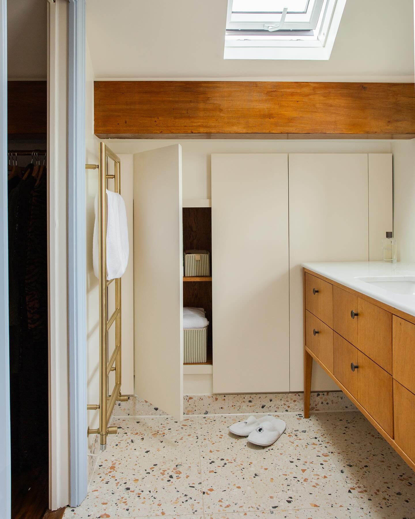 Sexy storage FTW.
There’s nothing better than bespoke joinery. Absolutely maximising every inch of awkward space, it’s the joinery that made this reconfiguration possible.
What once were 2 x skinny long rooms were knocked into one larger space. I utilised the areas with reduced head height for hanging space in what would be the new walkthrough dressing room and closed storage in the en-suite bathroom. Two small Velux windows were added to the roof to help create a better sense of light and space.
The whole top floor feels totally different now, it’s not only beautiful to look at it but it really works. And really that’s what our homes should do.
📷 @alicekemp__