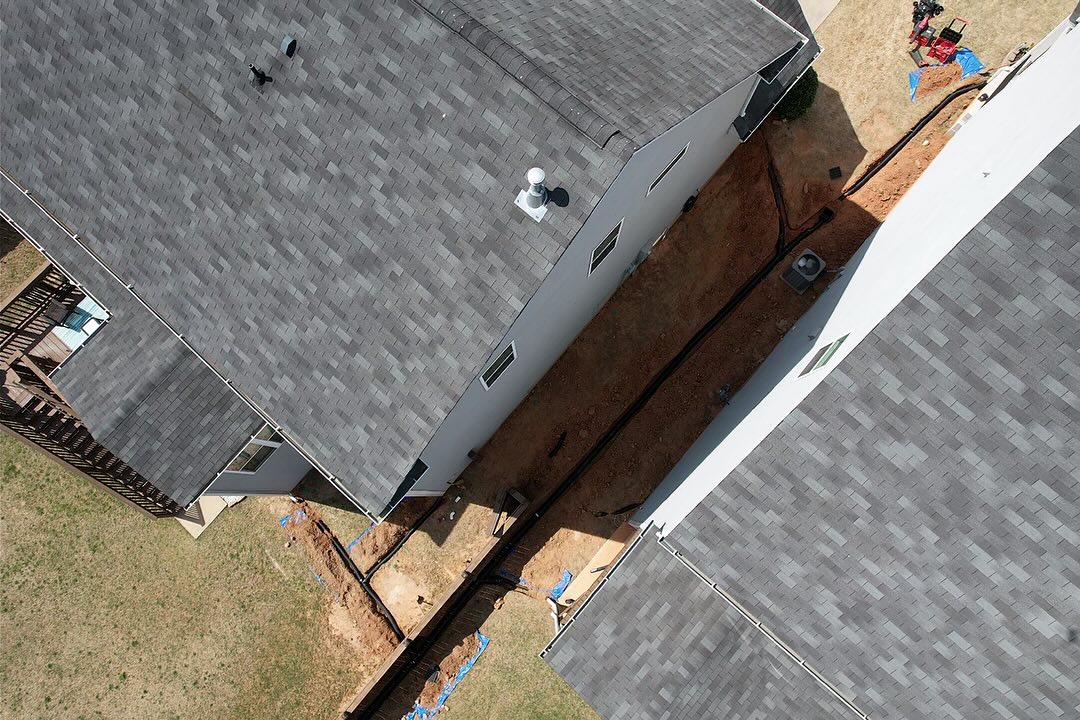 We love this! These neighbors came together to tackle this space between their properties and split the cost, which in turn, saved them both thousands of dollars. Got all the downspouts buried, installed a couple of catch basins, and re graded this area. Finished off with some grass seed and pine-straw. We need more of this! Let’s work together, not against each-other!