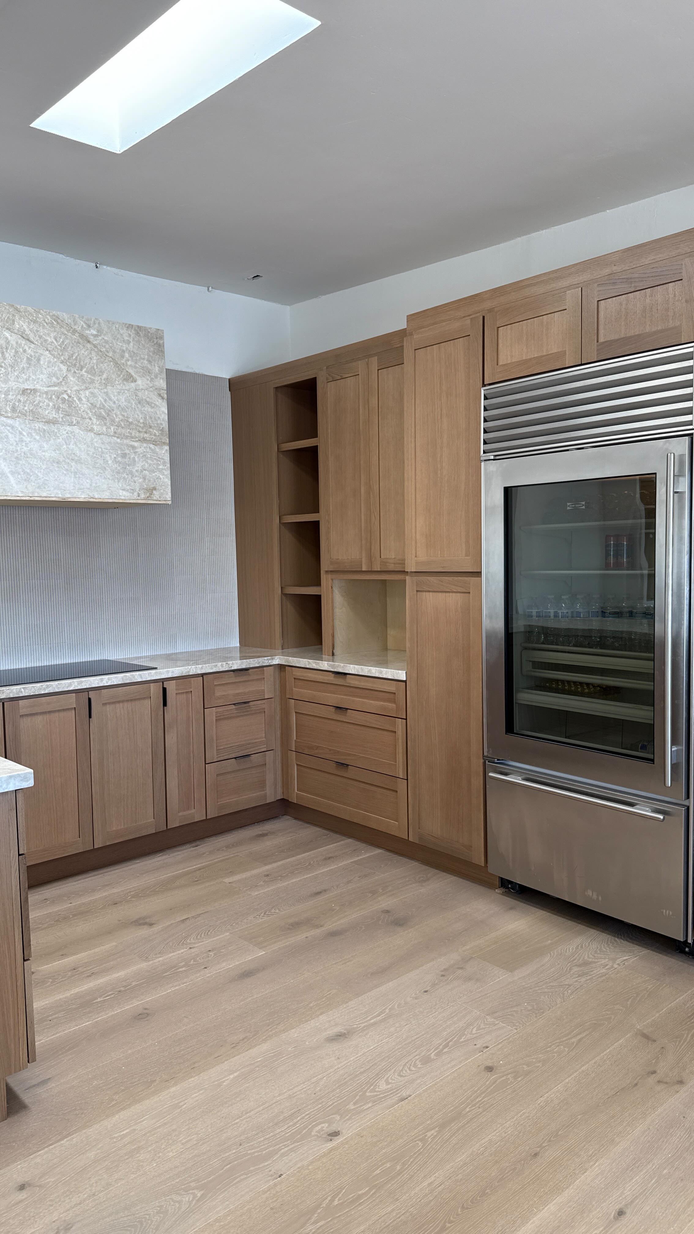 New addition to our showroom - soon to be completed!
We’re excited to unveil this stunning new kitchen display featuring timeless white oak shaker cabinets paired with a luxurious Taj Mahal quartzite countertop and hood cover. The soft veining of the stone complements the warmth of the wood perfectly. A sleek modern backsplash adds a subtle texture, pulling the whole look together with elegance and ease. Come see it in person—you’ll fall in love with the details!
#KitchenDesign #ShowroomStyle #WhiteOakCabinets #TajMahalQuartzite #ModernBacksplash #LuxuryKitchen #InteriorDesign #KitchenInspiration #QuartziteCountertops #ShakerStyle #NeutralInteriors #WarmWoodTones #HighEndDesign #CustomKitchen #InteriorStyling #KitchenTrends #DesignerKitchen #NaturalMaterials #StoneDetails #KitchenDecor #ContemporaryDesign #KitchenGoals #HomeDesign #KitchenLove #DesignDetails