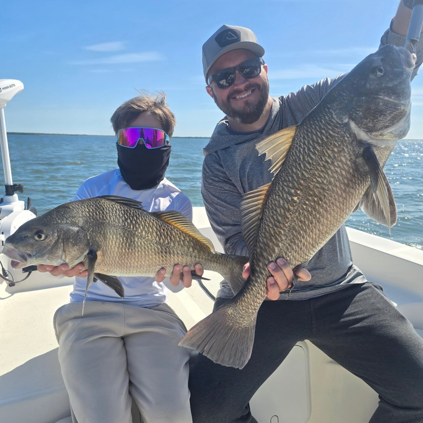 Father son teaming up on some black drum. #buckedupapparellc #coderedfishingcharters #floridalife #floridafishing #floridafishingproducts #newsmyrnabeach #mosqutiolagoon #4horsemancorks #sordknives #xtratufboots #kto_customrods www.coderedfishingcharters.com
