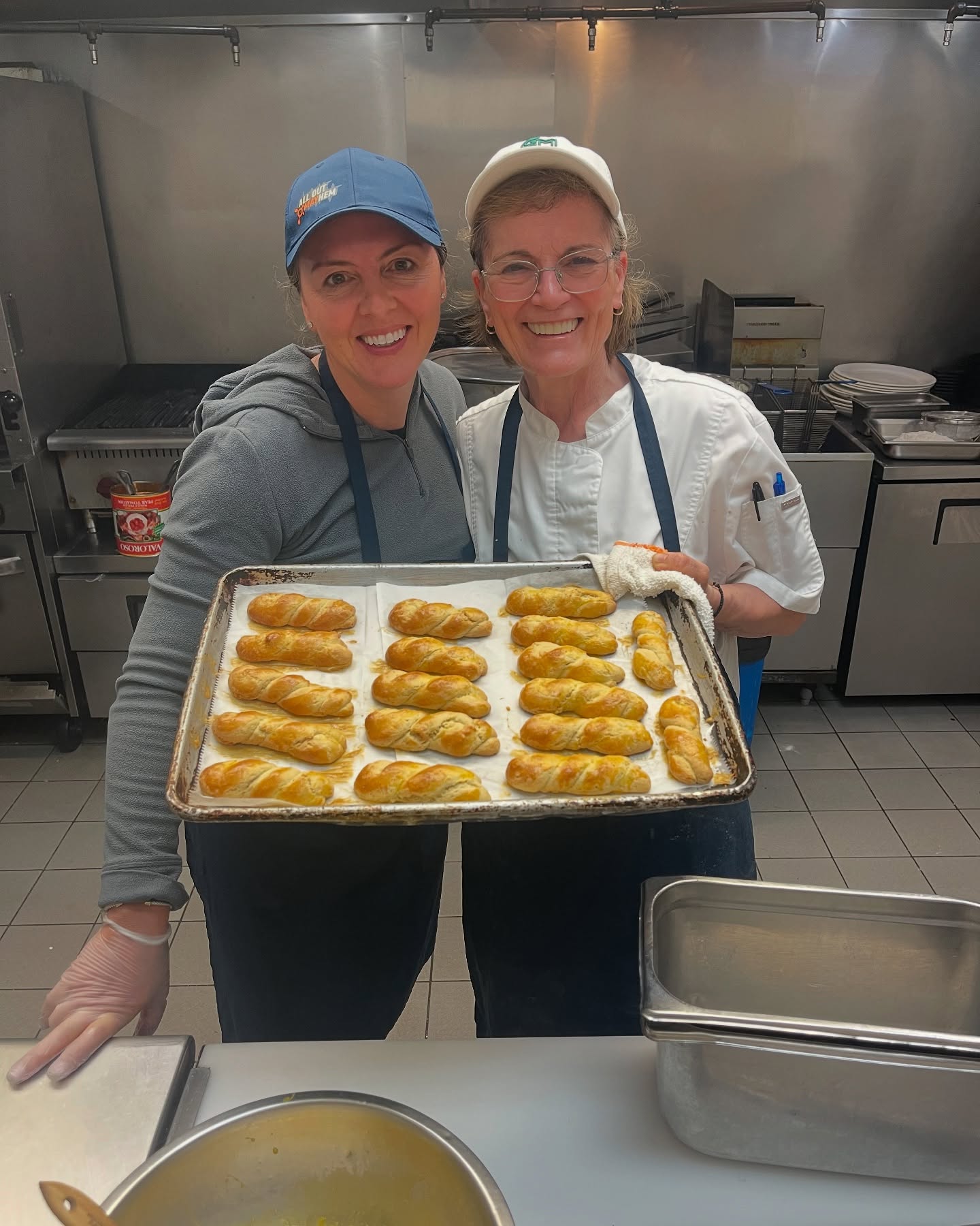 Mother and daughter preparing traditional braided cookies and red dyed Easter eggs for Greek Easter! Every now and then our sister drops in to help out our Mom - it’s a true family affair over here! 🐣 #kalianastasi