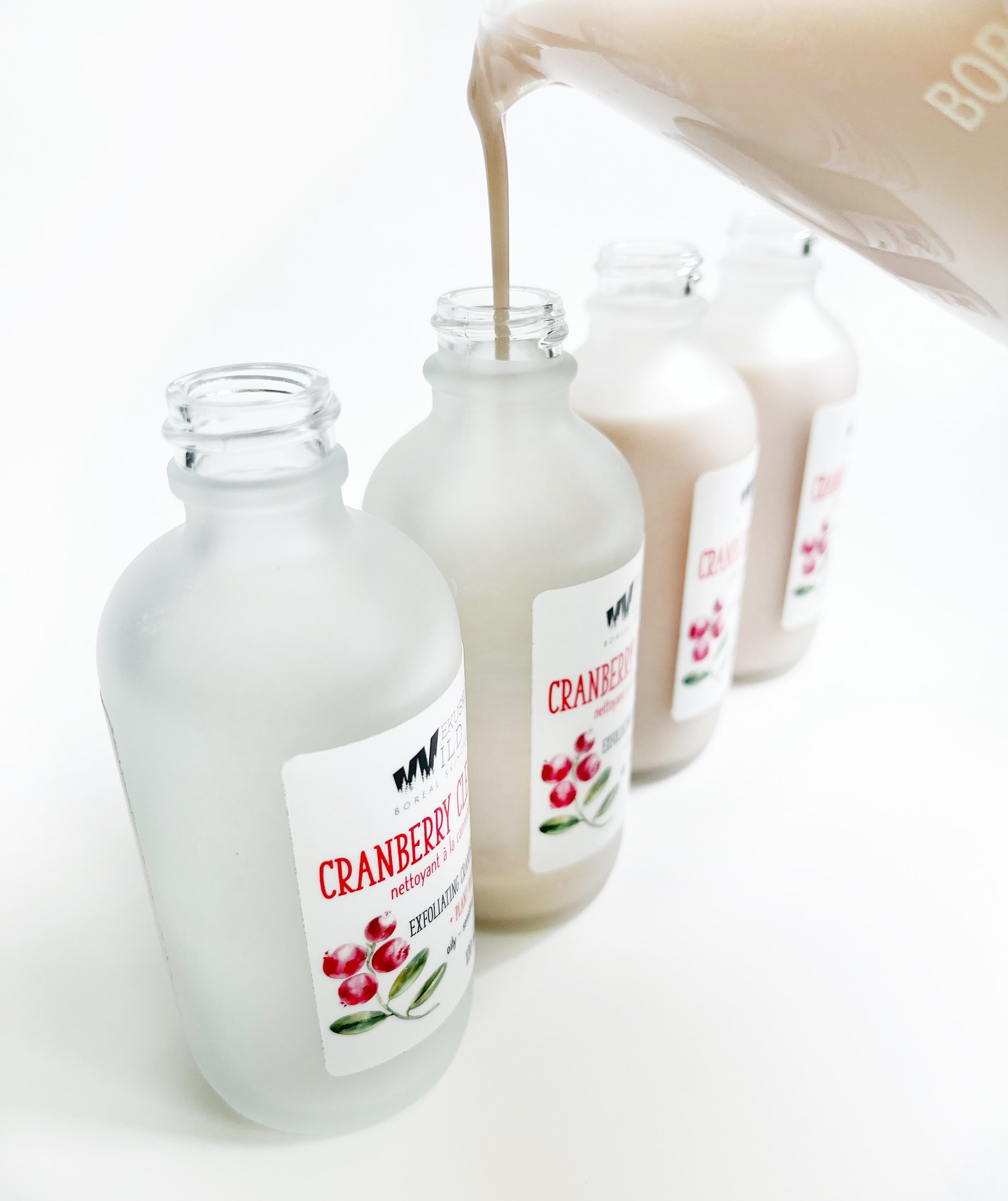 Microbatched cranberry enzyme cleanser - just 6 bottles at a time! This delicate pink cleanser is pH friendly and supercharged with soap free plant-based cleansers made from coconut and apples. It easily cleans off waterproof makeup and sunscreen with little effort while leaving your skin smooth and moisturized with grapeseed oil. Willow bark extract and cranberry enzyme gently exfoliate dead skin revealing fresh clean skin without the tightness. Sensitive skin safe! #cleanser #soapfree #phbalanced #cranberry #enzymecleanser #naturalskincare #willowextract #exfoliate #sensitiveskin #wekuskowild #womanrun #manitobamade #iamtheteam