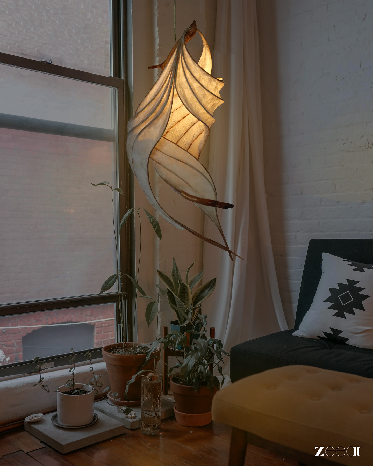 A sculpture of light, now glowing quietly in a cozy corner.
.
#sculpturelight #lampshade #interiordesign #homedecor #zeearlife