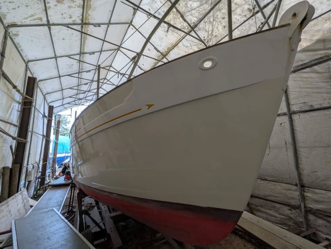 Dandiprat, Peter Duck class, has been owned by the same family who commissioned her build over 50 years ago. She has been kept in Pin Mill for several decades. She came in one of the painting tents to have some small repairs, her topsides repainted, decks and cabin top repainted, and her cabin coamings taken back to bare wood, epoxy sealed, and revarnished. We also sanded back the cockpit and revarnished it.