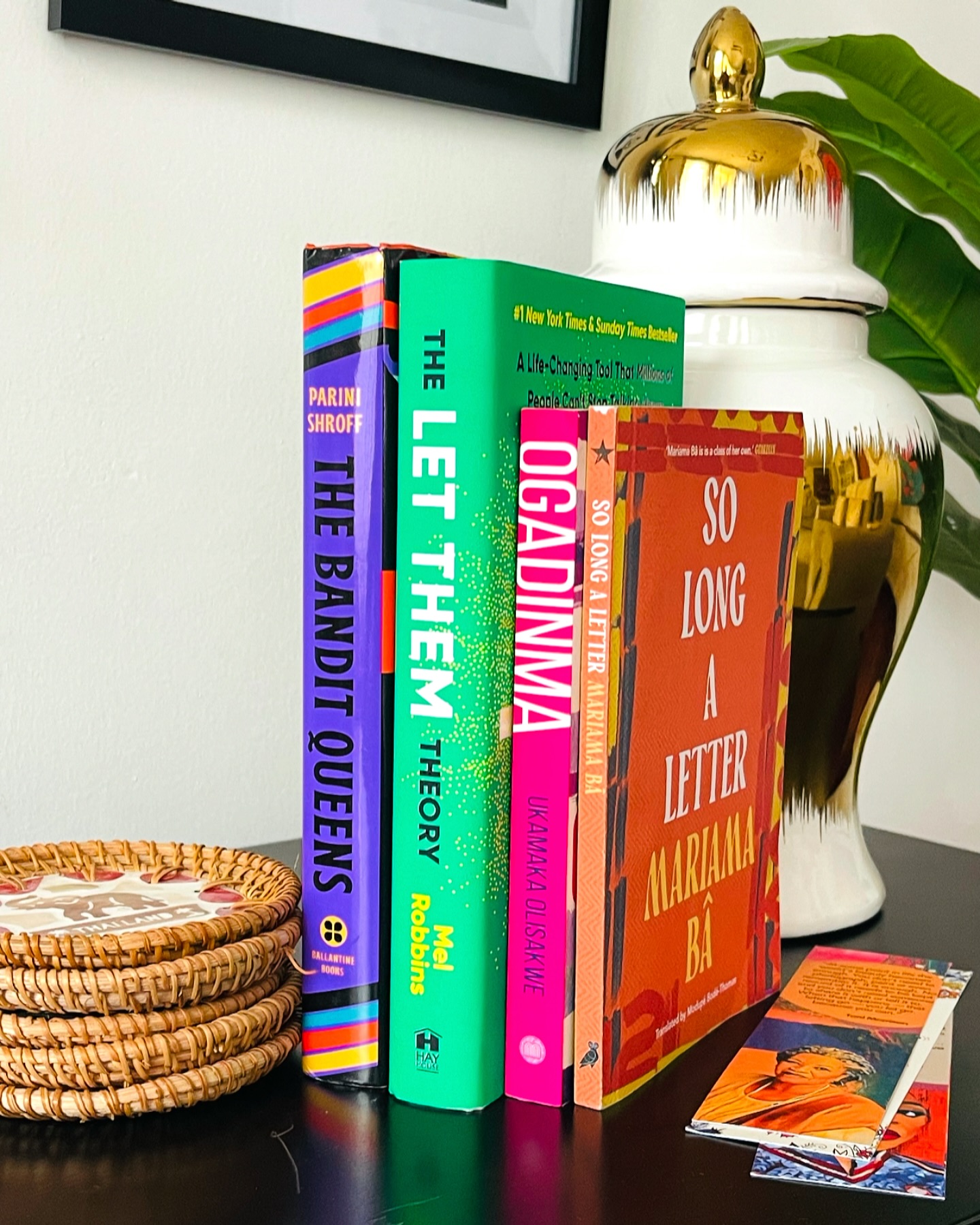 On my bedside table…I’ve been having very little time to read and surprisingly that has turned me into a bit of a poly reader. We’re moving slowly but we’re getting it done
The Let Them Theory by Mel Robbins 📚- a lesson in sometimes all you really need is a change of perspective. What this book is doing for me is freeing me from the weight of carrying so many people’s opinions, actions and behaviors and trying to control each and every little thing in my life. Just Let them, and let me! This should be on everyone’s shelf…I promise, you need this.
So Long a Letter by Mariam Ba📚- I am slowly making my way through the Heinemann African Writers Series (AWS), now republished by Head of Zeus. This was originally published in 1979 and follows a series of letters from Ramatoulaye to her friend Aissatou reflecting on their lives and their silent suffering as women, wives and mothers, after the death of her husband. I’m re-reading this series as a study and analysis on how African writing has changed (if it has) and not just the writing but also the context. In this one, I’m really questioning if the situation for women - the burdens and expectations- has changed since the 70s. It sure doesn’t feel like it.
Ogadinma by Ukamaka Olisakwe 📚- A book I had really slept on for a long time and one that definitely blew me away. It’s heavy, it will anger you and make you upset but it is also hopefully. This was published in 2020 by Masobe and the story is set in the 80s following the life of Ogadinma and how her quest for an education led her into unfortunate circumstances that shaped her life. If you’ve read Tomorrow I Become a Woman and loved it, pick this up ASAP!!!
The Bandit Queens by Parini Shroff 📚- this is a darkly funny feminist tale about Geeta, a woman wrongly rumored to have killed her husband, and how that dangerous reputation leads her into a wild ride of sisterhood, revenge, and unexpected freedom as other women start asking her to help them “remove” their own terrible husbands. I just started it and loving it immensely!!!
What’s on you bedside table?
#books #reader #bookstagram