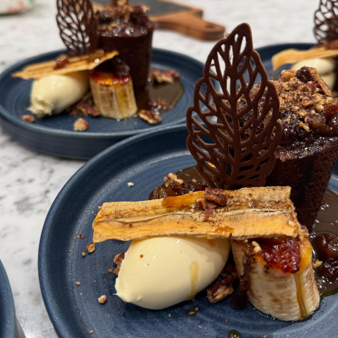 The Classics Menu 🍽️
The Classics menu is curated from dishes that I have created over the past 25 years with my signature recipes.
Sticky Toffee, Banana, Ginger & Pecan Pudding
Toffee Rum & Raisin