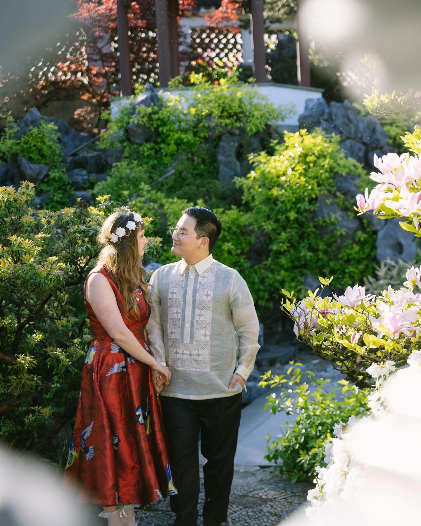 On April 26th, the day before our wedding, Kris and I had our secret garden party at the Dr. Sun Yat-Sen Garden, a little oasis right in the middle of Vancouver Sky Scrapers. I fell in love with the garden many many years ago while wandering Chinatown and when I met Kris it was one of the first places I brought him. Since then we’ve been there through the seasons, even on a snowy Lunar New Year. Getting to be in this garden, wearing a traditional Chinese dress, with my (to be) Chinese-Filipino Husband, eating Filipino food from Hapag @hapaggrill surrounded by people we love from literally all over, was a surreal and incredible experience. We had guests from the United States, New Zealand, Singapore, Hong Kong, the UK and the Philippines. We had crafts: tea bath making, a photo scavenger hunt, and a postcard collage station. Barret Bai, a 16 year old prodigy, filled the garden with guzheng music. It was all pure magic.
And amidst it all, the Lapu Lapu Day Tragedy occured. Kris and I truly feel our party was divine alignment and protection. We had so much of our loved Filipino community at the garden. Many of our friends didn’t go because of our party. Others left early to come. Because of this, we didn’t lose any of our loved ones. We were able to celebrate joy and love on an otherwise tragic day. In the evening, our feelings were complicated, but we were held by community, held by this special place. Grief and joy mingled together, such is the Jewish-Filipino-Chinese way. A true testament to the dual nature of life, one Kris and I navigate together, through our own unique blend of cultures. Thank you to you all, thank you for loving us, we learn to love each other better through you all. Photography from the incredible @tingphotography Can you believe these are just our preview photos?! Event coordinator: @eventsbybruno Makeup: @natbailey_ @rachelongll Food: @hapaggrill Location: @vancouverchinesegarden