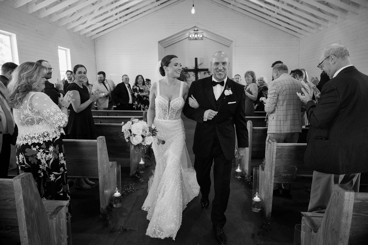 A moment suspended in time 🤍
Shannon, radiant in lace, walking toward forever under the glow of chapel light. With every step, the softness of film, the weight of memories, and the beauty of a love story unfolding.
Amazing shot captured by our associate photographer, Laura