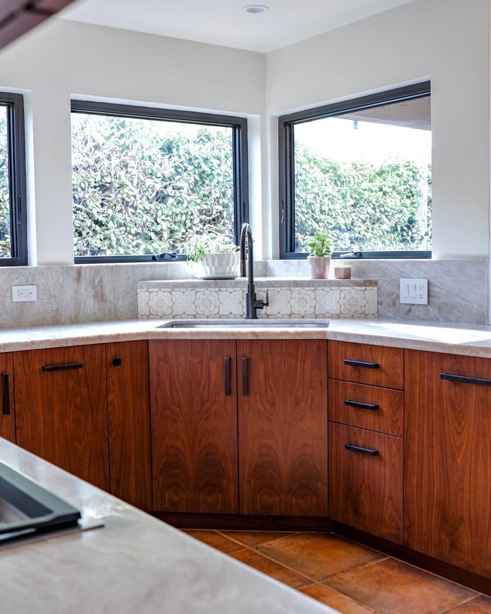 Walnut slabs and plenty of windows make for a premium kitchen. What do you think of this one?