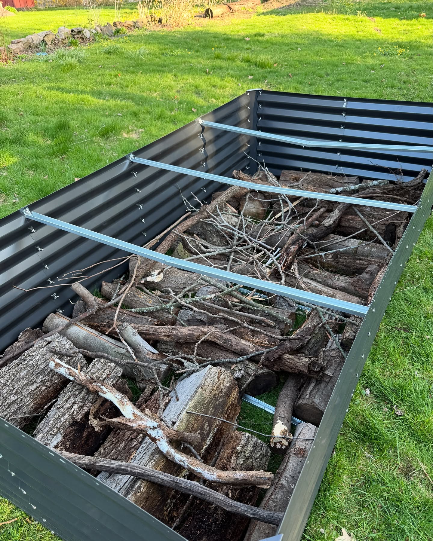 It was after I’d prepped this garden bed that l realized I forgot my cardboard weed barrier….. oh well!
I can’t wait to get this bed finished up and get another one assembled and setup for my seed starters!! I’ve got so many wonderful herbs and florals that are growing up so fast; they’re just itching to enjoy this beautiful spring weather.