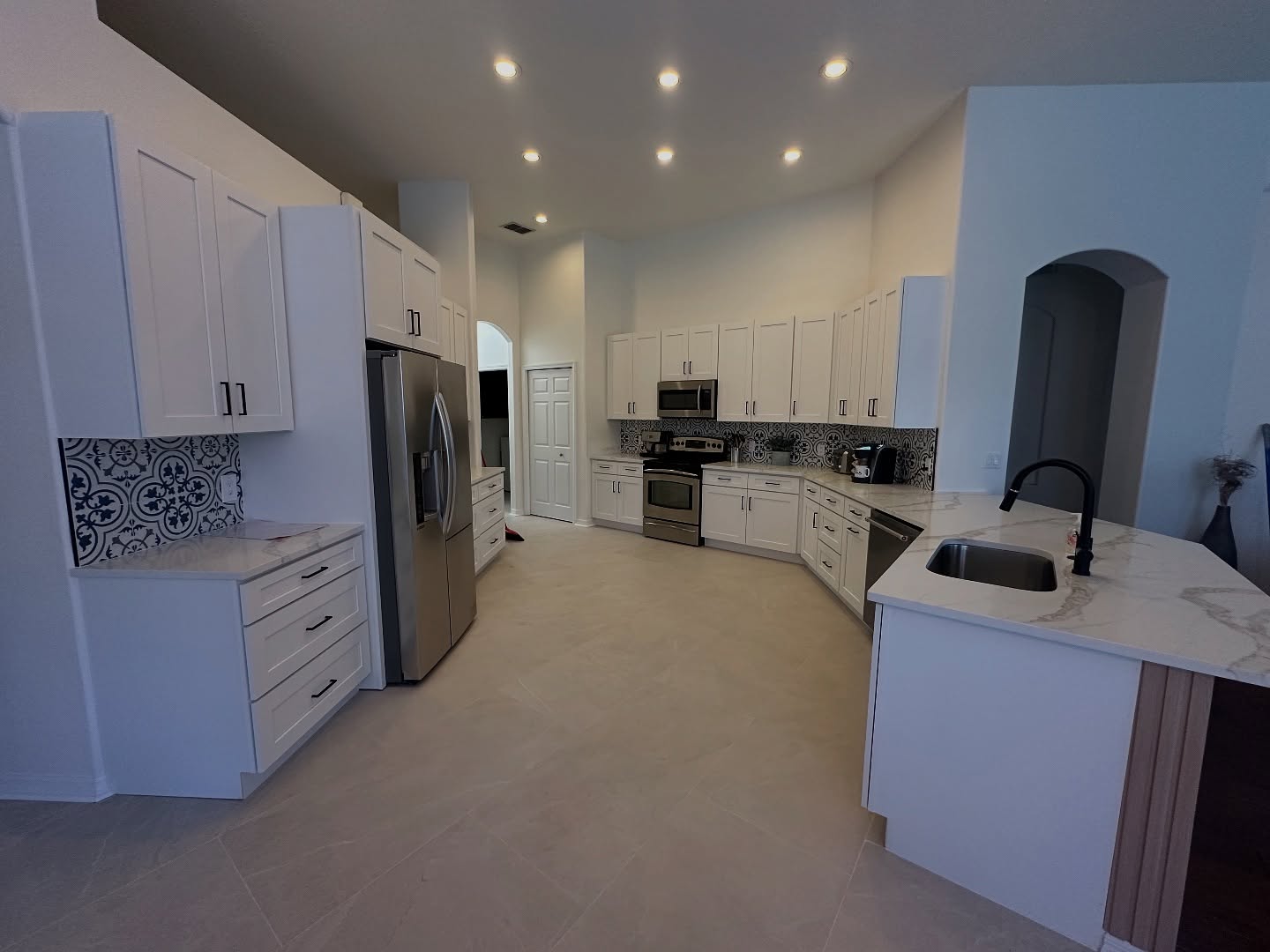 After a major plumbing leak damaged this kitchen and main living areas, we stepped in to restore it better than ever. From replacing drywall up to 4 feet to installing fresh finishes, this renovation brought the space back to life.