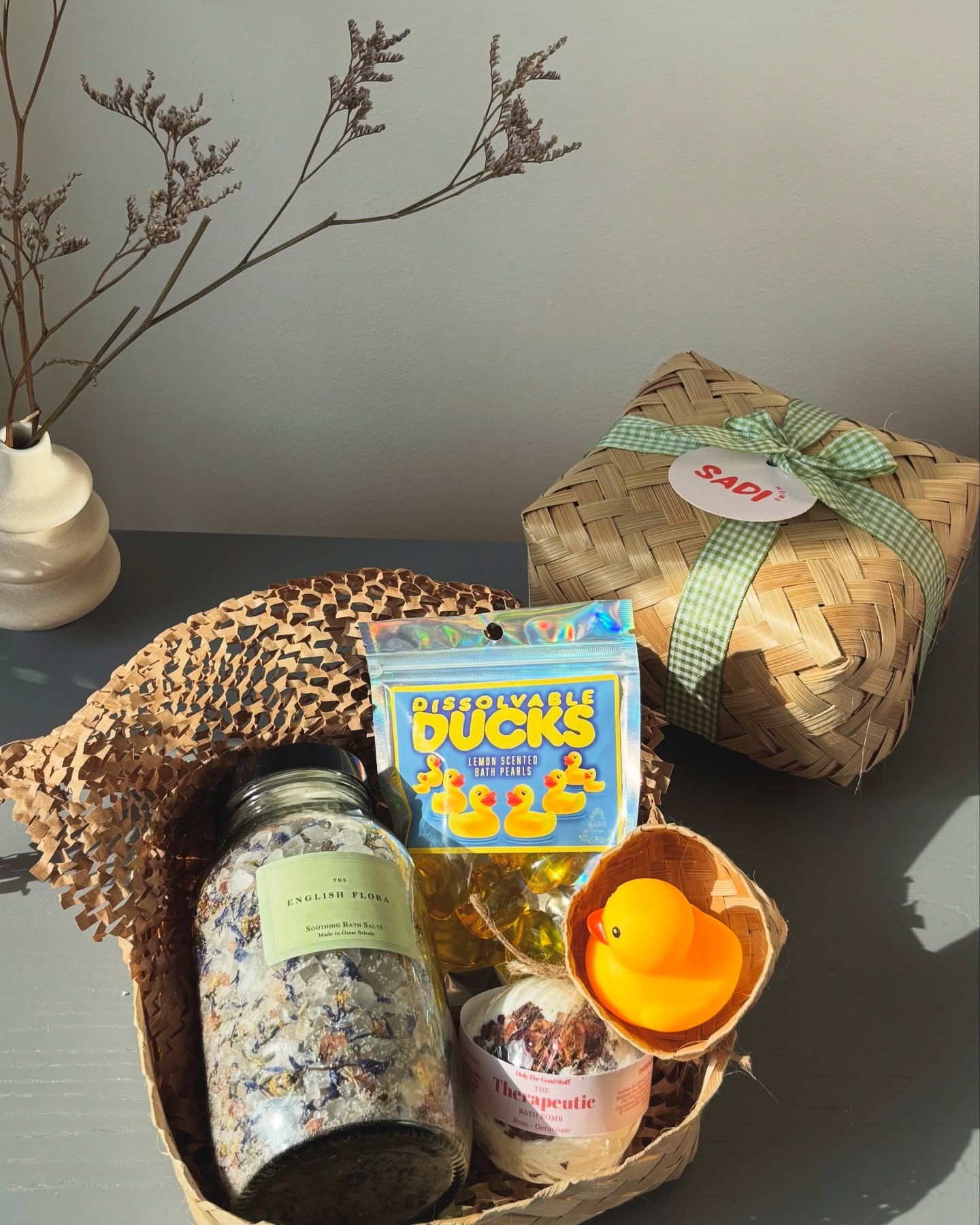 A bath bundle with English flora salts, a fizzy bomb, ducky pearls, and a cute wee rubber duck —packed in a handmade rattan box (yes, even the duck gets one) 🐥🛁🫧