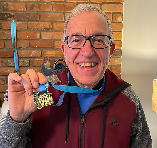 Nominations are now open for the LSM Performing Arts Hall of Fame Class of 2025! Visit www.lsmperformingarts.com/hof (#linkinbio)
As we lead up to the nomination deadline, we will showcase each of our current Hall of Fame Members.
The LSM Performing Arts Hall of Fame was introduced in 2022 with the intent of providing a way to publicly recognize members of the LSM family for going above and beyond with their service to the organization.
Carl Philpott
Class of 2022
Known affectionately as ‘Grandpa Carl,’ this beloved LSM volunteer has dedicated countless hours to the organization over the years. Carl’s meticulous work managing uniform lights and his expert contributions to prop construction were crucial to the success of LSM Winds during their historic 2022 and 2023 World Championship seasons. His attention to detail and hands-on involvement has made a lasting impact on the program. Carl’s kindness and generosity is felt by all—he treats every LSM member like family, always ready to lend a helping hand and ensure everyone is having the best day possible.