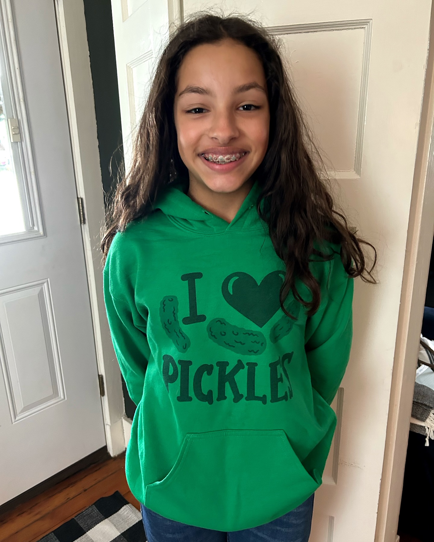 Happiest of days to our TWELVE year old. One more year of childhood for the Slagell children, and this one has enjoyed her childhood more than any of them.
We frequently can’t find her, and it’s always because she’s outside. Every day, no matter the weather. She loves sports and music and talking on the phone with her friends and pickles. Always pickles. She had on a different shirt this morning, and when I told her it was birthday picture time, she went to change into her favorite birthday gift so far. (Made by her Aunt Jen of course.)
Mira, our lives all improved when you joined our family. You are joy and laughter, fire and passion. We love to watch you work hard at school (no other child we’ve ever parented has put in the amount of work you do) and play hard at sports (even if that means you made two bigger boys cry in the space of ten minutes at soccer earlier this year). Next year is a new adventure at a new school, and we can’t wait to watch you tackle it. Maybe your thirteenth year of life will be the one where you stop falling down so much. 😉
You’re our love, sweet girl. Happy Birthday Miracle! 🥳💜