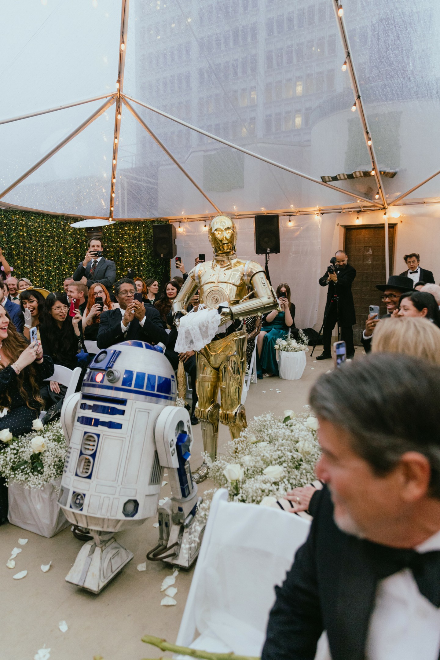 Not every couple gets a droid escort to the altar, but when the Force calls, you answer.
Andrew and Kristen turned their wedding into the ultimate crossover of love and fandom.
Whatever universe you're from, if it matters to you—it matters to us.
All are welcome here—well, except for Sith.
✨💍 #MayTheFourth #StarWarsWedding #TheOviatt
Photographer: @costellocaptures