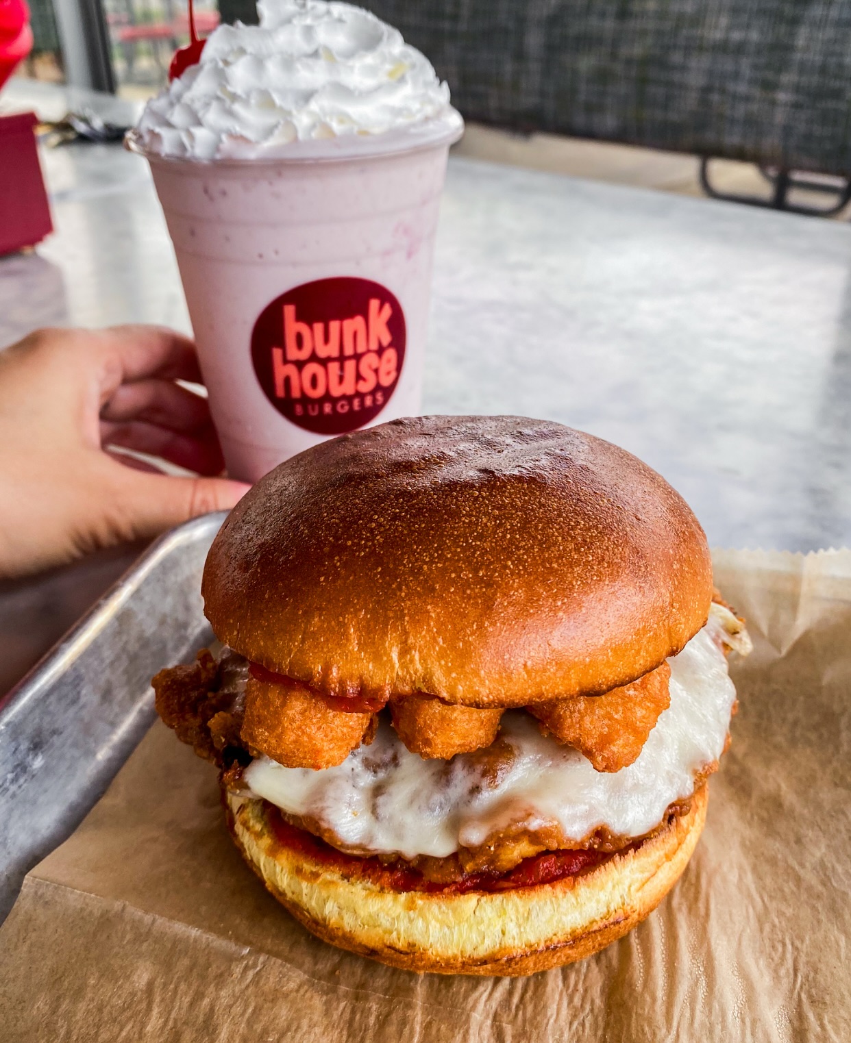 Spring in Michigan means patio season, lake days, and new Bunkhouse Burgers specials that are downright drool-worthy. 🍔🍦🌼
Chicken Parm Sandwich | 8.50
fried chicken, marinara, mozzarella sticks, & provolone on a potato bun
Strawberry-Banana Shake | 6.50
vanilla soft serve blended with banana, strawberry puree, topped with whipped cream & a cherry
Available this month only.