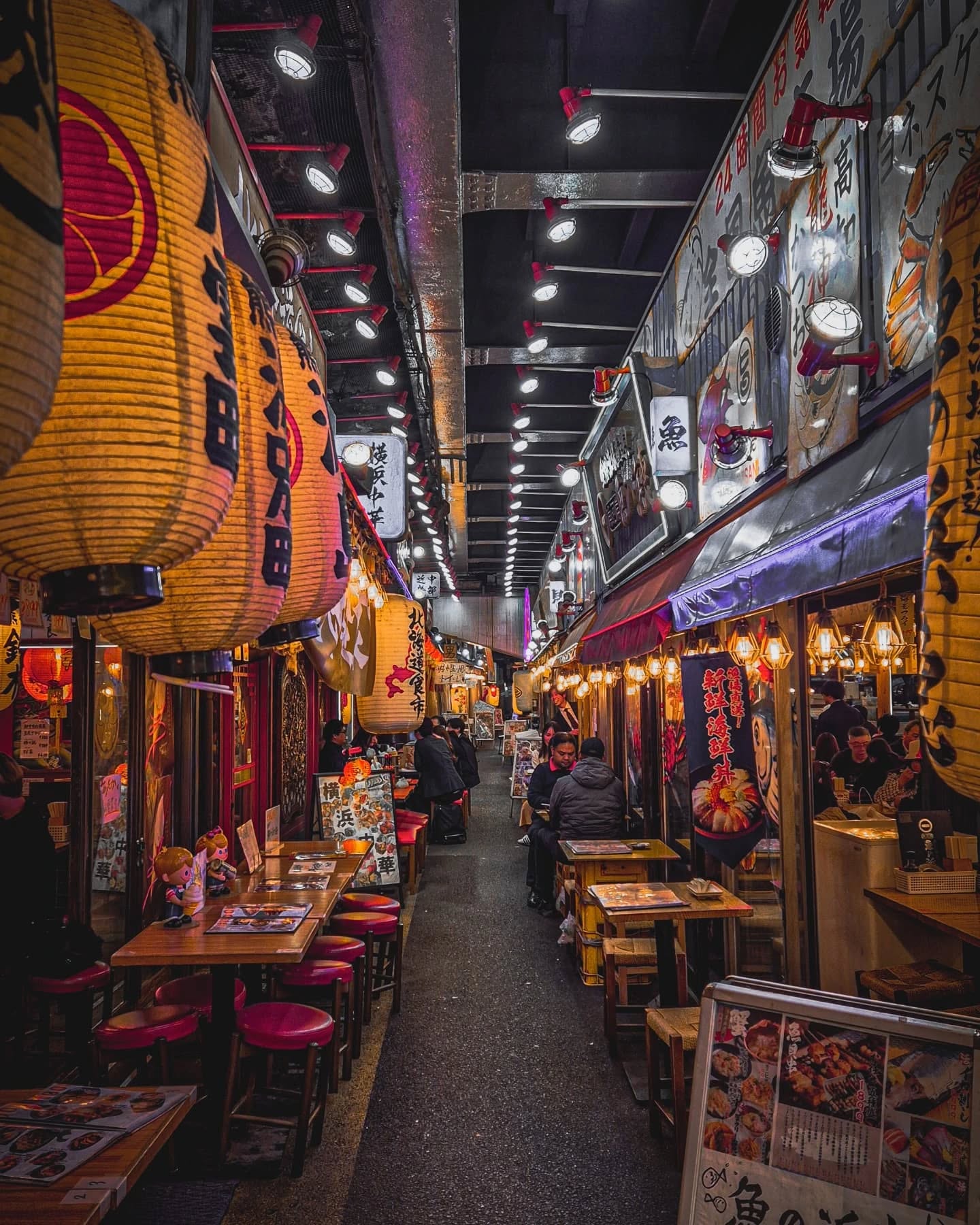 Tucked behind the bright lights of Shinjuku on one side and Ginza on other, lies Omoide Yokochō — aka “Memory Lane”… or as locals cheekily call it "Piss Alley".
By day, it's a humble maze of tiny eateries. But at night? It transforms into a buzzing backstreet bar scene straight out of a movie — filled with sizzling yakitori, cold sake, and stories of salarymen and women and tourists shared elbow-to-elbow under glowing lanterns.
What started as a post-war black market in the 1940s is now one of the most authentic, atmospheric places to eat and drink in Tokyo. It’s gritty, it’s nostalgic, and it’s SO worth the visit.
💡𝗜𝗻𝘀𝗶𝗱𝗲𝗿 𝘁𝗶𝗽:
Grab a stool at one of the hole-in-the-wall izakayas (space is tiny), order the grilled skewers, and don’t be afraid to strike up a convo — locals love a good chat!
Add this to your Tokyo itinerary NOW🏮🏮
👉🏻 Best time to go? Golden hour to late night.
Come hungry. Leave tipsy. Make memories.
🔖Tag your foodie crew & save this post!
#tokyotrip #japantraveltips #omoideyokocho #tokyonightlife #tokyoeats #hiddengems #thingstodoinjapan #visittokyo #streetfoodphotography #budgettraveller