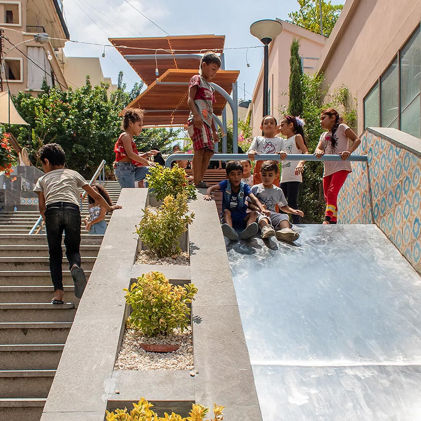 How can we make stairs more playful? 🌀🛝
In Beirut, an ordinary concrete staircase has been totally transformed into a vibrant space for community, connection, and play 🎨✨
Designed by @catalyticaction the project kicked off with local workshops and even used Minecraft to let children help reimagine the space! 🎮🧒 Their ideas came to life through clever features like slides, speaking tubes, shaded seating, and bold colors—turning a once-overlooked path into a playful pause point for all ages.
This is what happens when community, creativity, and design come together. Let’s rethink the way we move through our cities 💡🌍
Location: Beirut, Lebanon
Completed: 2022
Designed by: Catalytic Action
Images: Catalytic Action
#CitiesForPlay #ChildFriendlyCities #UrbanRevitalization #PlayfulCities #UrbanDesign #Placemaking #CityForPeople #Play #PlayfulUrbanism #UrbanPlay #PublicSpace
