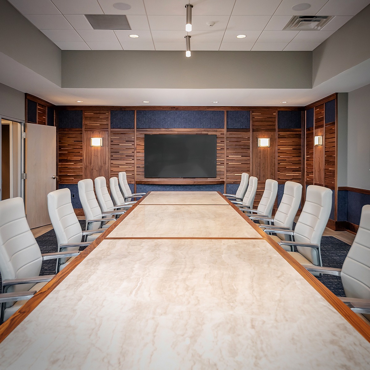 ~CAL Auto
-
This custom conference room features a handcrafted walnut table with a seamless stone inlay, designed for both elegance and durability.
The surrounding walls are wrapped in dimensional walnut panels, blending slatwork and natural grain to bring warmth and depth to the space.
A perfect balance of modern design and timeless craftsmanship.
-
-
-
#customwoodwork #conferenceroomdesign #modernmillwork #walnutdetails #taylormadecraftsmanship