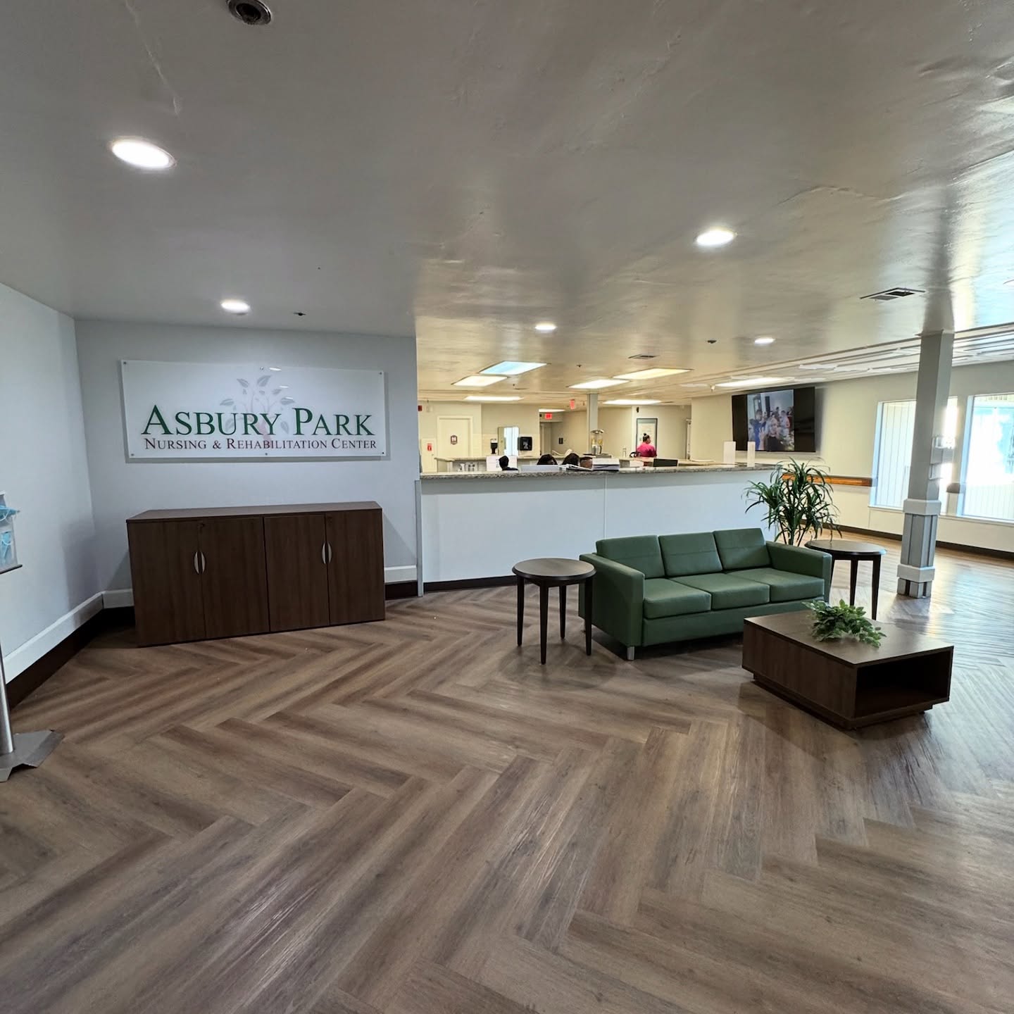 A warm welcome starts with thoughtful design and that’s exactly the energy these green chairs bring to the space! Welcome to the reception area at Asbury Park Nursing & Rehabilitation, a space that’s both functional and inviting for residents, staff, and guests.