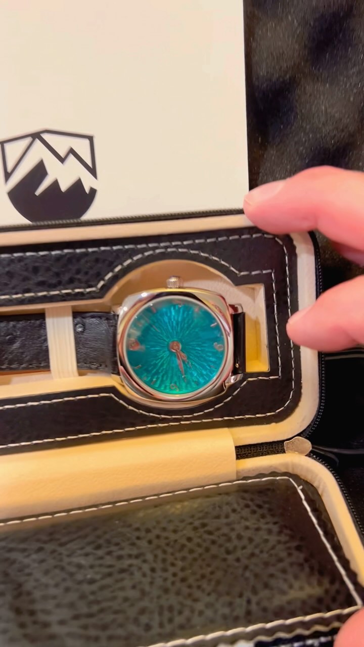 Join us as we share the excitement of unveiling something truly special! Watch as we reveal the breathtaking teal Ajax watch. Its grand fue enamel and hand turned guillochè dial is a testament to exquisite craftsmanship. Inside you’ll also find a personalized thank you note and a warranty card ensuring our valued customer has peace of mind with every tick. Plus we’ve included an extra ‘tropic’ band for added versatility and style. Celebrate the artistry and passion behind 5280 Watch Company with us. Welcome to the family John💙 we so hope that you and your wife enjoy your custom watch for years to come! #5280WatchCompany #unboxing #watchartistry