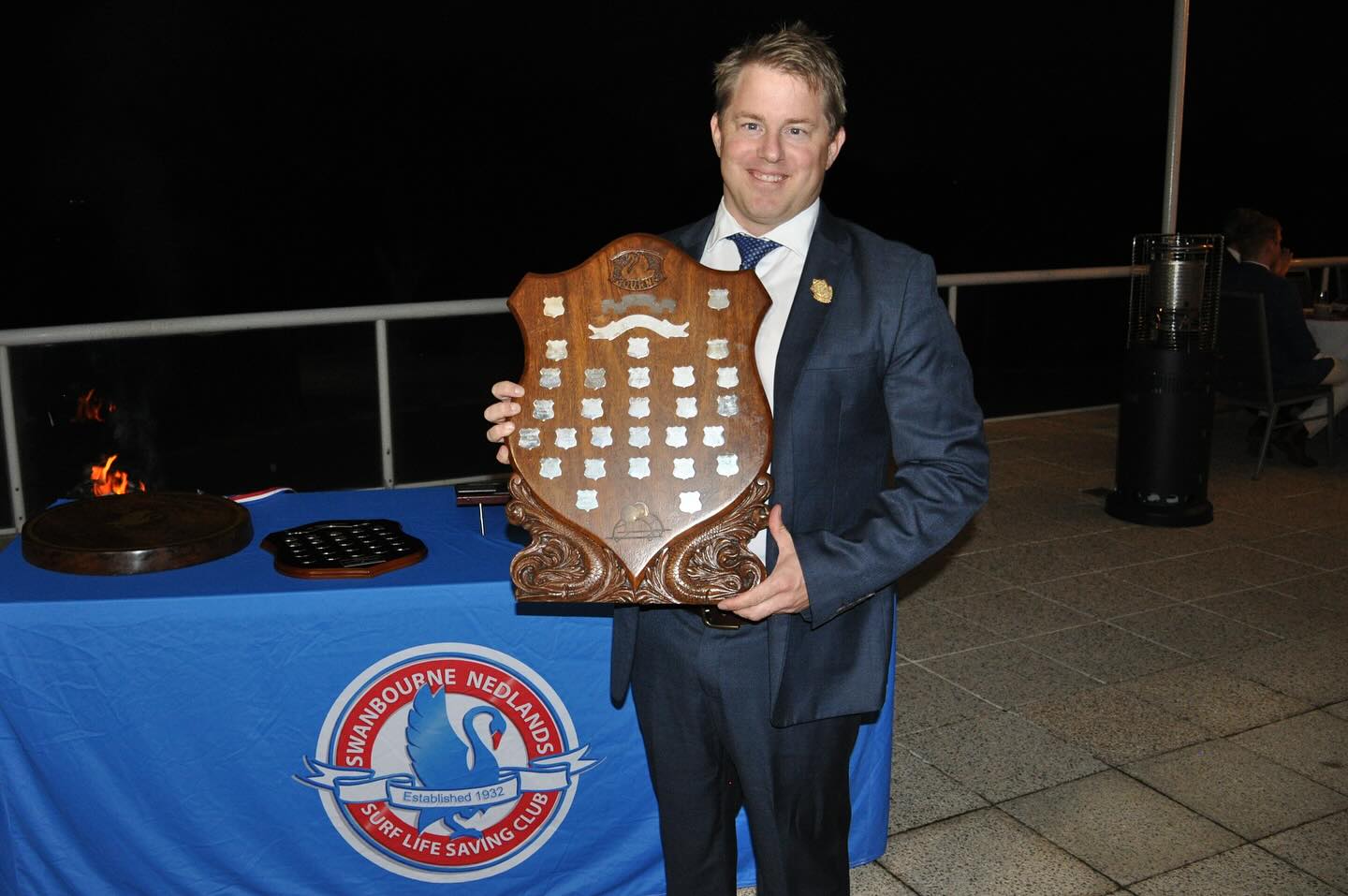 Swanny’s Patrol Member of the Year, for the 2024/25 season is Graham Sharpe.
Graham is someone who truly sets the benchmark — not just for how he patrols the beach, but for how he helps build Swanny’s lifesaving culture. He has been a steady hand on the sand for over two decades, but it is for his outstanding contributions this season that he receives this award.
Graham’s leadership on patrol is renowned. To highlight just one example — while leading Gadsby Patrol one Saturday, an incident occurred on the beach. Calmly and professionally, Graham managed the situation as Patrol Captain. Shortly afterward, and without being asked, he compiled and submitted a detailed incident report to the Lifesaving Manager, complete with lessons learned and suggested actions. Graham also lead coordination of the Water Safety team at the 2025 Swanny Ocean Classic.
It’s this kind of quiet leadership that makes everyone around him more confident, more prepared, and more connected. Graham fosters the inclusive, supportive spirit that makes Swanny what it is, while mentoring new lifesavers and leading his patrol with energy.