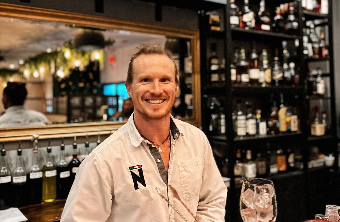 Meet Dylan..heâs more than just a bartenderâheâs the heart of the bar experience.
His passion for crafting exceptional cocktails is matched only by his love for great conversation. Guests are drawn to his easygoing nature, genuine curiosity, and the way he makes everyone feel like a regular.
Outside the bar, heâs an accomplished triathlete, Ironman, and Patagonman athlete, constantly pushing his limits and seeking the next big adventure. His energy, dedication, and adventurous spirit bring a unique and inspiring presence to our team and to every guest who sits at the bar.
Donât worry if you donât see him in June, heâs taking a small sabbatical trip to Europe to explore new cultures, trails, food and wine. Heâll be back in July filled with new ideas, experiences, and stories to share. Stop by to see him this month and wish him safe travels.
We are surprising him today with this custom plaqueâDylanâs Bar. Hope to have it hanging up at the Noto bar for many years.
Thank you Dylan for years of dedication and the positive vibe you bring to the company. Your presence contributes to the culture of this little restaurant which strengthens the Noto team. â¤ď¸â¤ď¸â¤ď¸