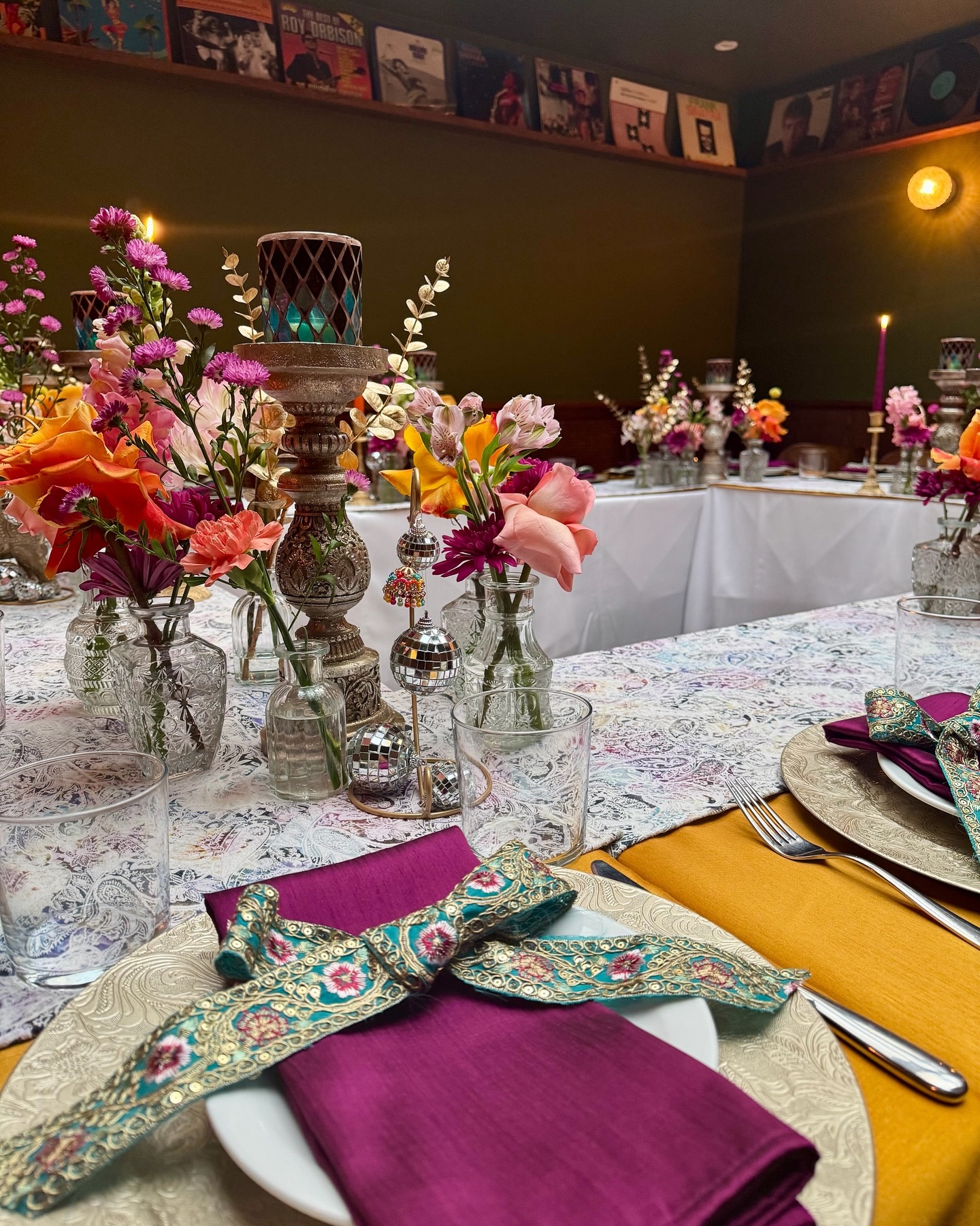 Intricate ribbons beautifully tied to dress the vibrant napkins were a showstopper. But by the end of the evening, they became headbands! Even the men joined in, fully embracing the Indian disco spirit. We love it when guests make our details part of the fun! ✨
#InteractiveTablescaping #IndianDiscoVibes #CreativeTablescape #LuxuryEventStyling #DiscoTheme #PartyDecor #TableSettingInspo #CushteLondon #EventFun #empireempire #tablescaping