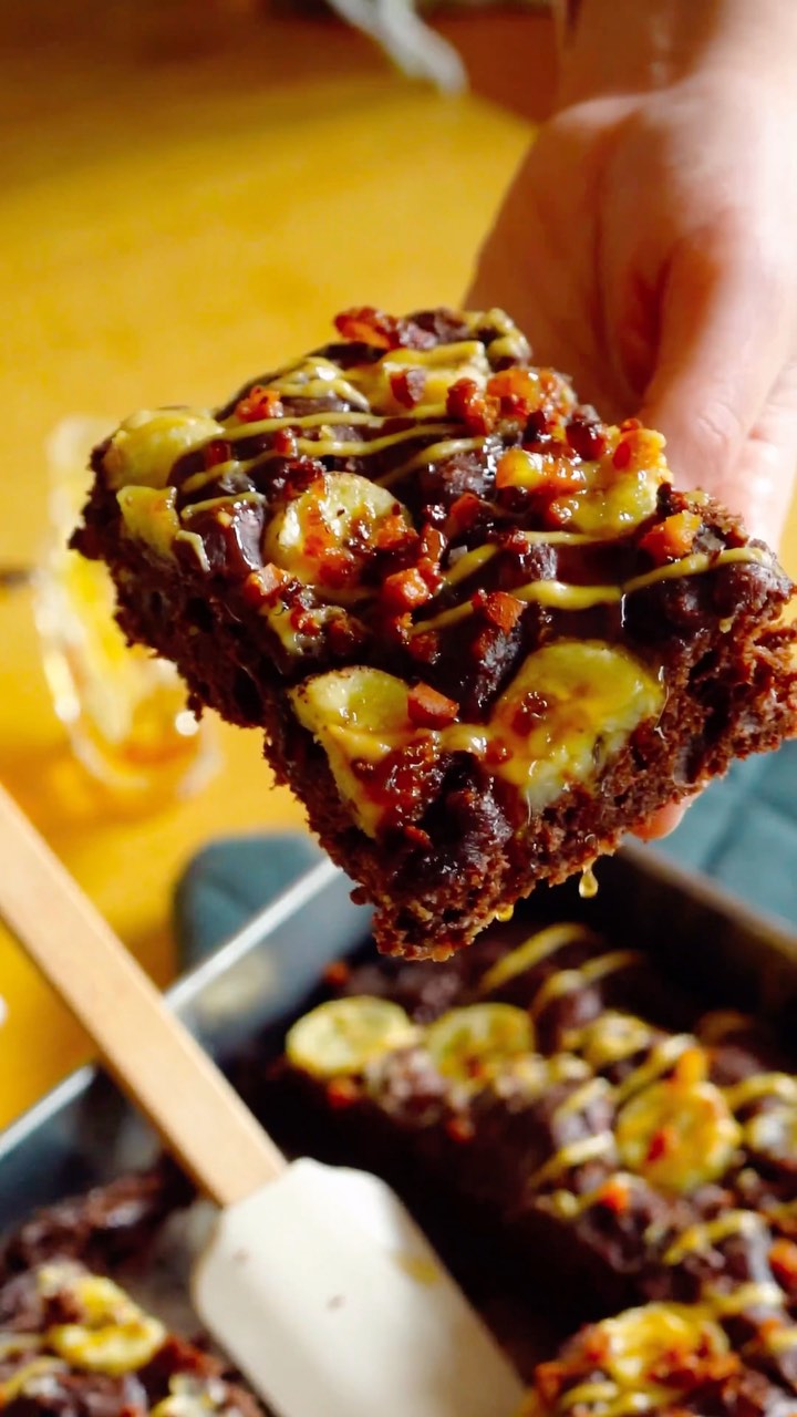 Random fact about me, I’m an Elvis fan, and I’m particularly obsessed with Elvis impersonators. I’d go so far as to say if I don’t have one showing up at my 40th birthday or wedding anniversary or something then there’s gonna be a problem.
I’m also a fan of the Elvis sandwich, which if you haven’t had, is a banana and peanut butter sandwich named after the king himself bc he loved to eat them. Some people would say it must have bacon, but it’s debated if his sandwiches actually included it. But, I guess that’s the ‘murican way, so let’s roll with it.
I wanted to see if this legendary sandwich would work as a focaccia…and it totally does. Wow.
I used a plant-based bacon, which was truly out of this world. I also put a little spin on the peanut butter part by making it into a special kinda sauce and Rasmus had the amazing idea to torch some sugar on the bananas. Some other additions like maple syrup, vegan butter, and flaky salt also took it up some notches. I even put some cocoa powder in the dough to create a little contrast between the light banana and peanut butter colors. Just enough to make it pop but not overpower zee tastebuds.
You’ll wanna make this one. Comment “Elvis” to have the recipe sent to you 🍌
#elvisfocaccia #focaccia #elvis #elvissandwich #vegan #plantbased #breadmaking #baking