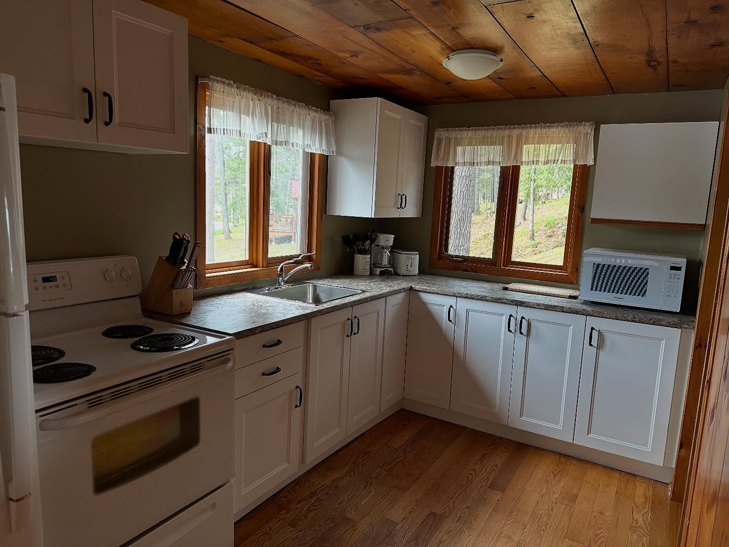 Two brand new kitchens just landed in our cozy waterfront cottages—because nothing says ‘vacation’ like pretending you’re on a cooking show while your toast burns. Cook with a view, spill things dramatically, and argue over the best way to chop an onion (there is no best way). Hope to see you soon, xo