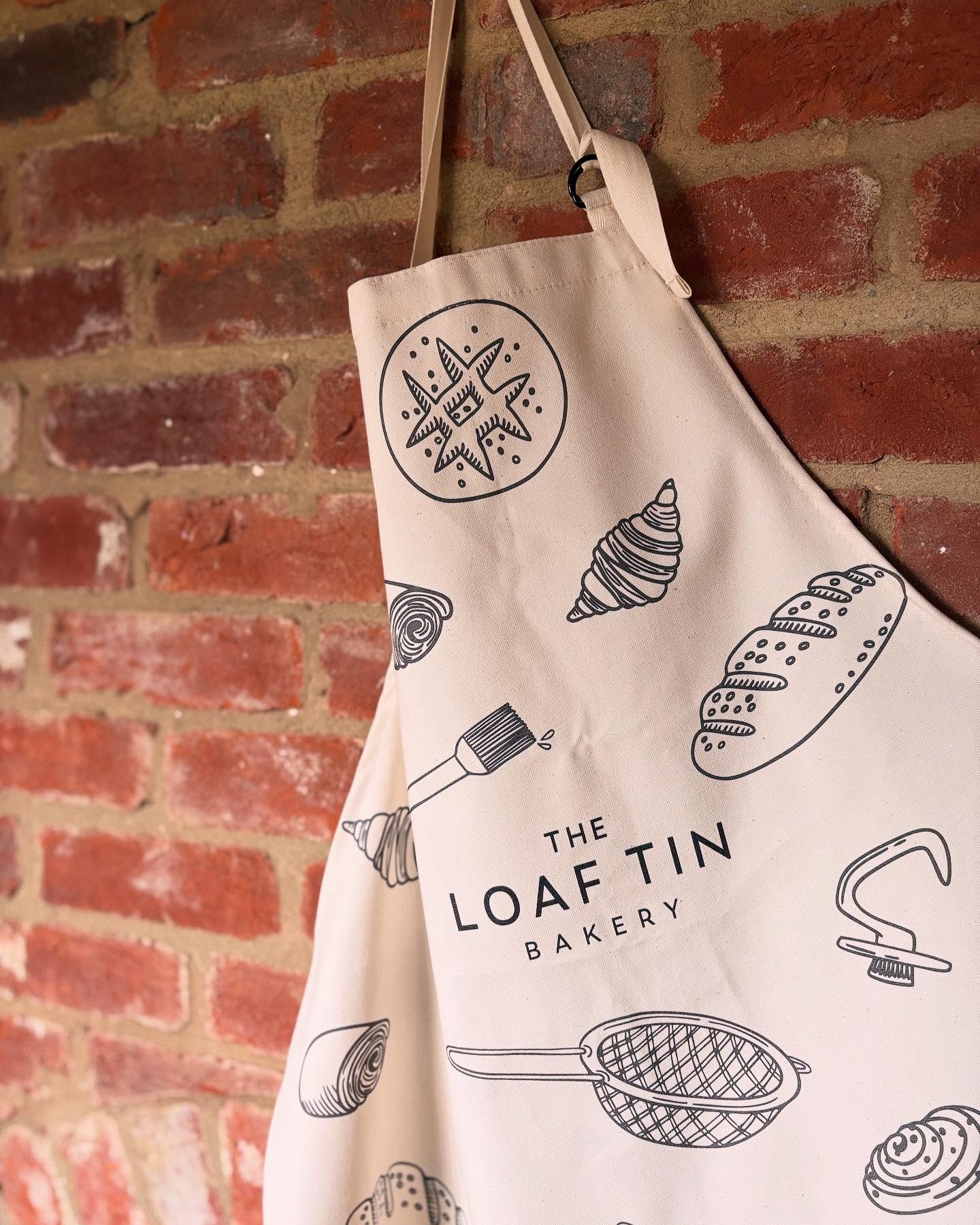 New merch launch 🚀 + a little promotional deal!
You may have already seen them in the wild and we’re super excited to launch our new tote bags and aprons.
A huge thank you to @wearebigbarn @arti.martie and Sarah monk for the awesome design and illustrations. We love working with such local talented folk - you guys are just amazing.
The tote bags and big and strong enough to comfortably carry two or more loaves and a big bag of pastries.
Aprons are adult size with an adjustable neck - perfect for those hiden chefs and bakers amongst you.
You can get your hands on them both in store and via our online shop (for store collection). We’re also offering a little 🔔 promotional deal 🔔for the next couple of weeks. Get yourself a free white or seeded sourdough with every tote bag or apron purchase. T-Shirts on the horizon too - can’t wait to share. #theloaftinbakery #merchendise #totebags #apron