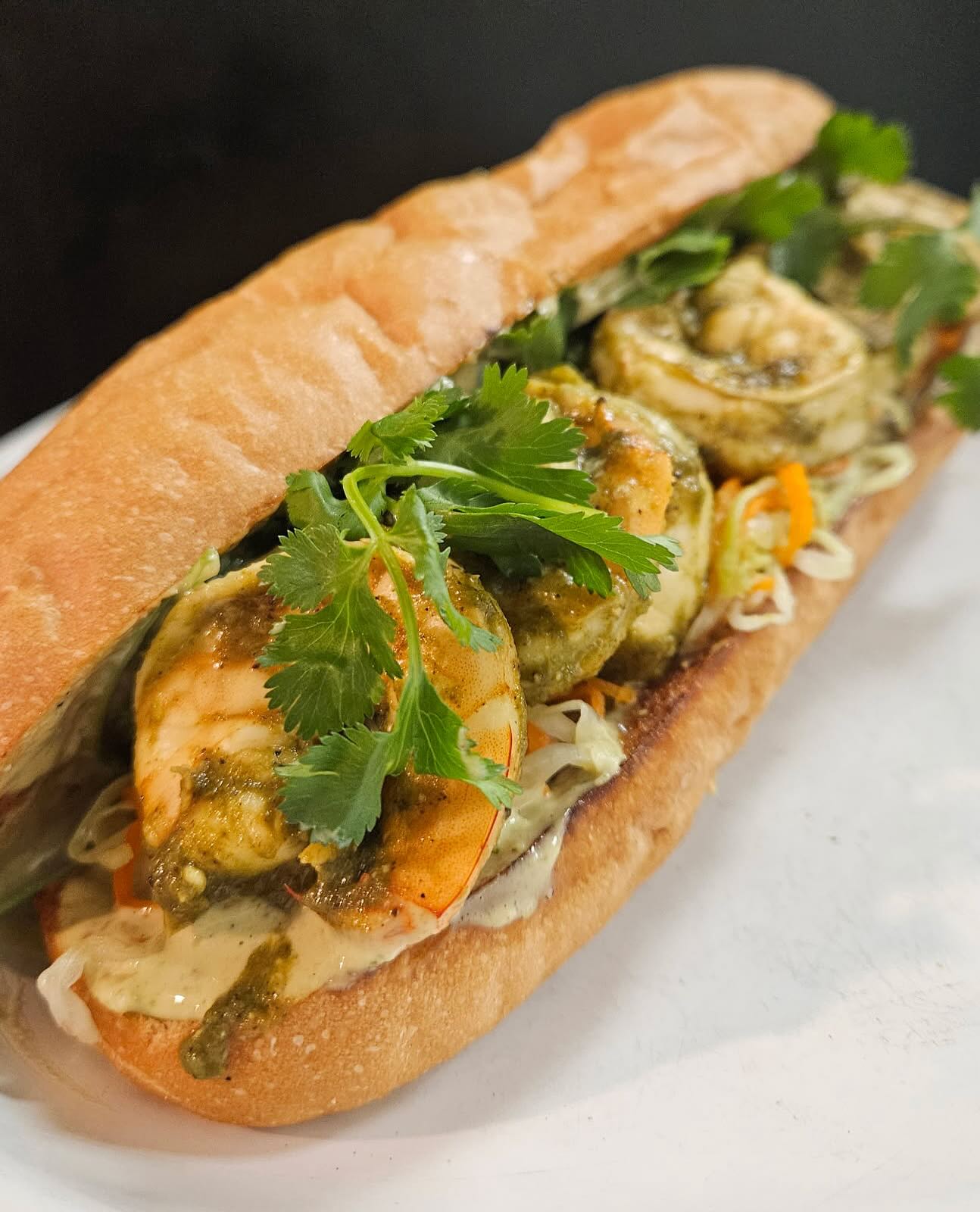 JERK SHRIMP BAHN MI - Matty Matheson series prt 2
Green Jerk marinated prawns, Matty vinegar slaw, cilantro and Jerk mayo, piled into an oven toasted French roll from Kootenay Bakery. Daily till 4 while supplies last.
Part II of our IV part sandwich series featuring recipes from Matty Mathesons latest cookbook, Soup, Salad, Sandwiches.