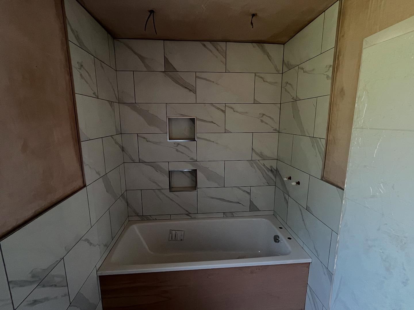 Work progressing nicely on the house build the first floor is well underway with a lot of 2nd fix carpentry do e few bits to finish tiling of bathrooms complete ready for 2nd fix plumbing plastering all complete upstairs now aluminium anthracite windows had been installed really taking shape getting ready for underfloor heating and floor screed next week on ground floor. #alderson #building #plastering #plaster #carpenter #carpenrty #tiling #tiler #plumber #plumbing #electrics #windows #doors