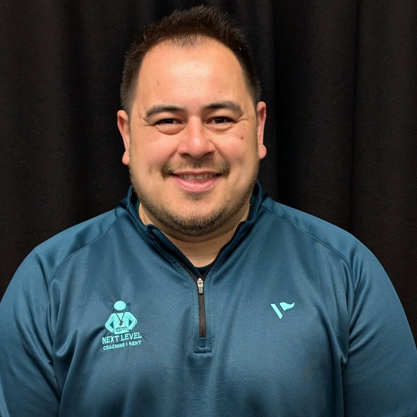 ᴍᴇᴇᴛ ᴛʜᴇ ᴛᴇᴀᴍ: Mark Roughsedge
Director of Coaching & Sport Development
Mark brings a wealth of unparalleled experience across the coaching spectrum—from grassroots and player pathways to the international stage. Within the sports development sector, he has held a range of influential roles across local authorities, professional sports club foundations, national governing bodies, charities, non-profits, and community-based initiatives.
At Next Level, Mark works closely with organisations to develop and upskill their workforce, building tailored, fit-for-purpose toolkits that drive meaningful engagement in sport and physical activity. As an experienced workforce developer and dedicated tutor, Mark specialises in working within underserved communities, with a particular strength in creating inclusive, person-centred environments where sport can truly thrive.
Driven by a passion for empowering communities through sport, Mark has a proven track record in mobilising local assets and forging strong partnerships to deliver impactful, sustainable physical activity programmes.
Outside of work, Mark is a die-hard Rugby League enthusiast, enduring the emotional rollercoaster that comes with supporting the mighty Warrington Wolves R.L.F.C. (affectionately known as ‘the Wire’). Ever the optimist, he remains convinced that each season will finally be the year of the Primrose and Blue.