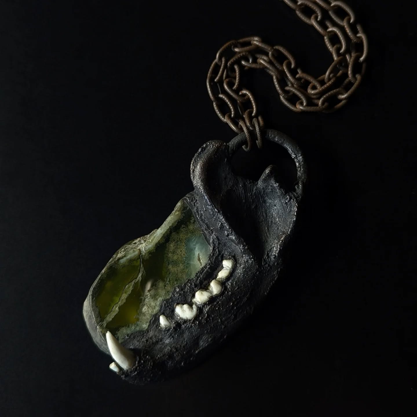 an amulet for the May Queen of Beltane
the maypole spun, a twisted door, a silent pact with something more
embodiment of vitality and so-
ever looming mortality
prehnite forms in the fractures
-healing the spaces-
within igneous rocks
she honors the in-between
molten flow between solar plexus and wild heart
strong back, soft front
215 c prehnite
found raccoon jaw bone- copper plated
#beltane #bealtaine #mayqueen #goddessworship #goddesdembodiment #landlistening #firefestival #celticfolklore #wheeloftheyear #darkfolk #pagan #bonejewelry #prehnite #magicamulet #ritualadornment