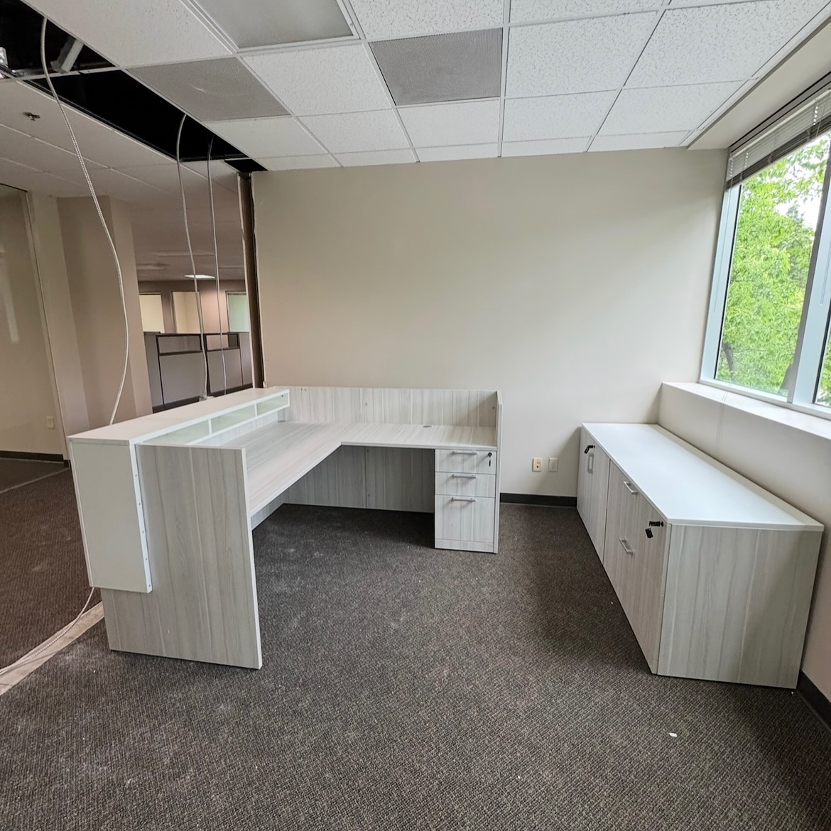 Check out this project featuring pre-owned Herman Miller cubicles and a new Silver Birch reception desk and private office!