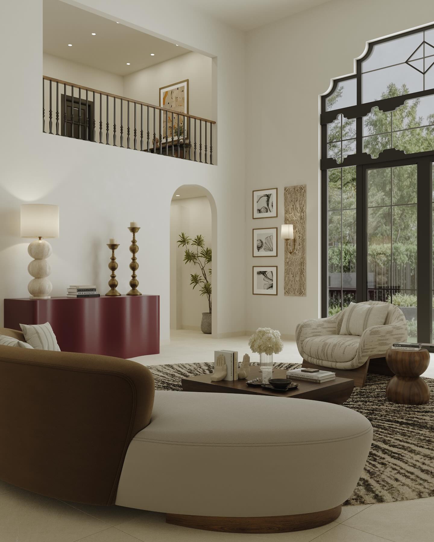 Soft curves, structured silhouettes and a palette that quietly demands attention.
This living room blends modern sophistication with soulful heritage. The double-height ceiling and arched window with Indian-style detailing create an airy, dramatic backdrop, while the neutral palette keeps it grounded. A curved, dual-tone sofa and low wooden coffee table form the heart of the space, styled with curated books, ceramics, and florals that speak to understated elegance.
Rich textures and sculptural forms add depth—like the plush armchair, ribbed stool, and deep oxblood console styled with tall candle stands and a sculptural lamp. Coastal sketches, a carved wood panel, and an arched niche with a tropical plant infuse warmth and cultural charm, making the space feel both refined and rooted.
.
.
#furbishyhomes #interiordesignmelbourne #interiordesignindia #homeinteriors #homestyling #interiordesign