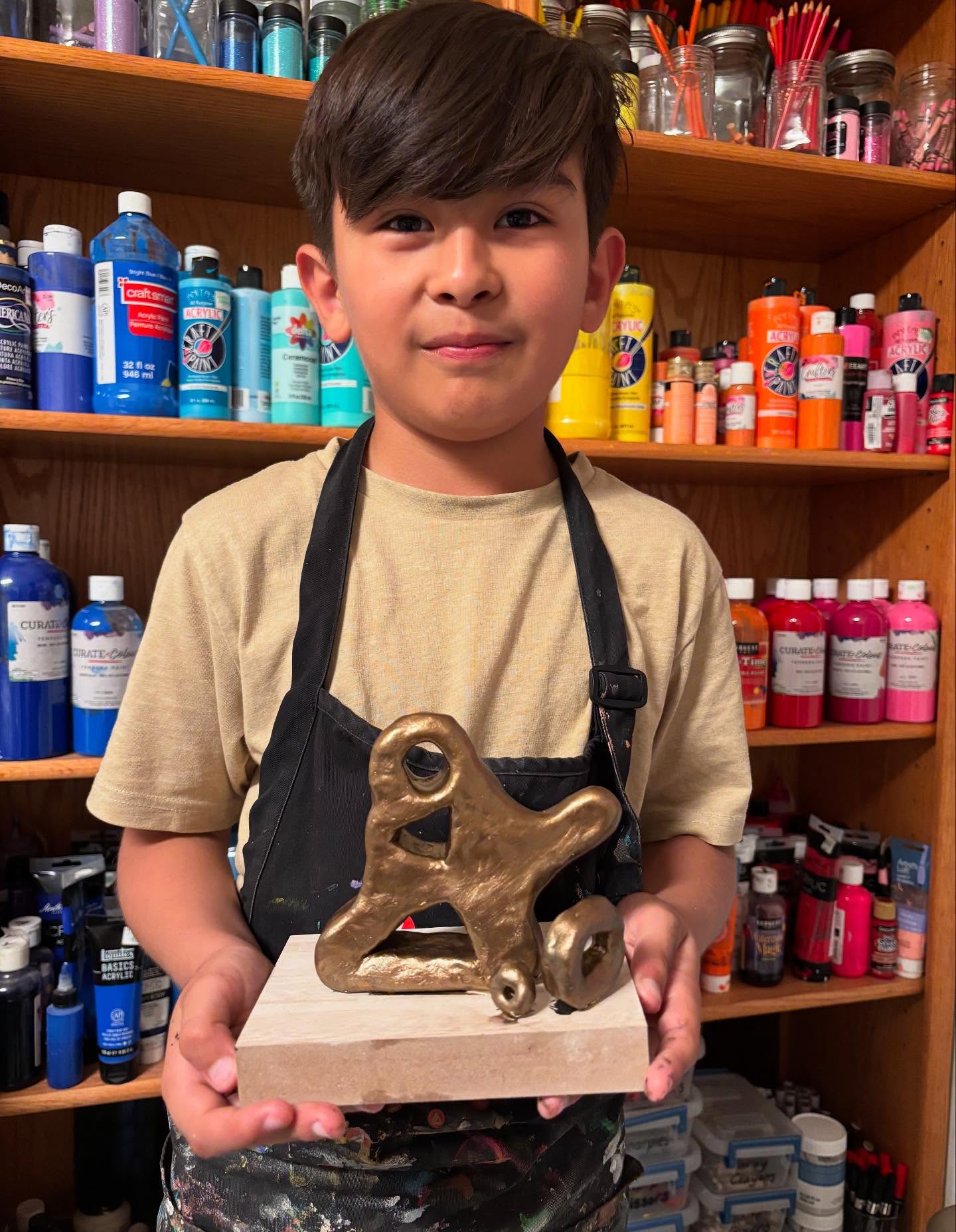 Level 2 had their final class before summer. We finished our study of Henry Moore's sculptures. Each child chose a pose and walked through the steps to create an abstract sculpture in Henry Moore's style. I love how everyone's came out.