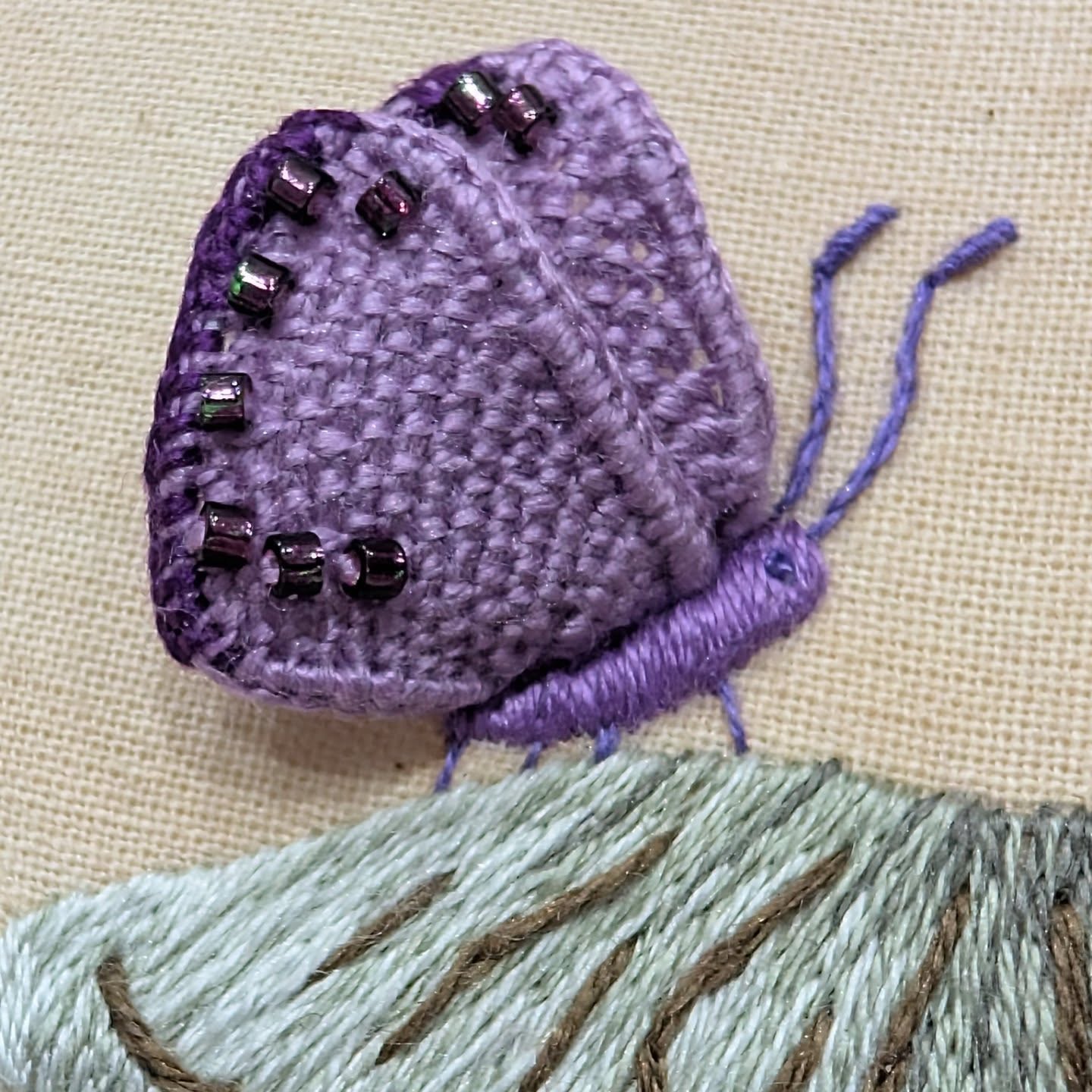 Can't beat a purple butterfly 🦋🤣
Making great progress on my Mushroom box class, for the 3rd session we worked the needle lace wings. So that my students could see what I was doing, I switched the cream&black for purple, as the cream blended in with the tracing paper on camera.
I have to say it looks great in purple 💜 and I found these cute purple/black iridescent beads in my stash rather than the copper.
I have a bit more homework to film next week but we start the box cutting/covering and construction on Fridays session so no huge rush.
#mushroom #embroideredboxes #butterfly #stumpwork