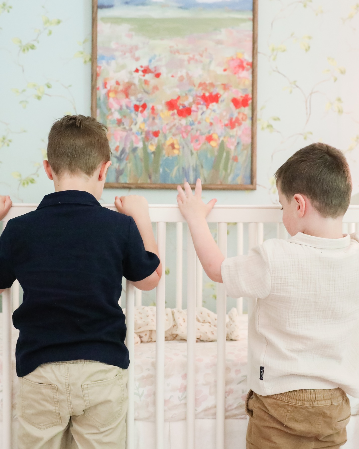 Melting over editing these sweetest family photos I've ever seen! These two brothers love their little sister! Andddd this nursery decor 😍