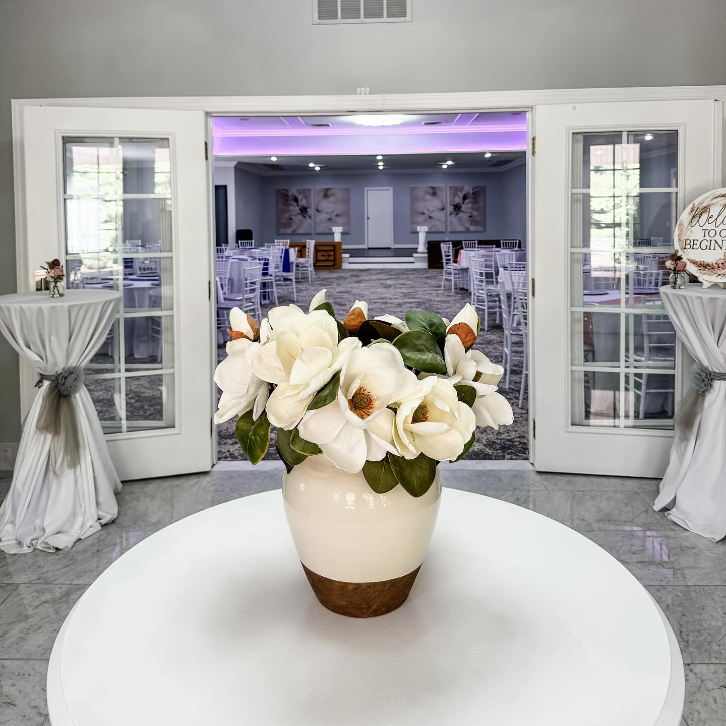 Step into your wedding day with elegance from the very first moment. ✨
At Villa Magnolias, every detail—from the soft glow of the reception space to the welcoming florals in the foyer—is designed to make you feel celebrated. Imagine your guests being greeted with this view as they step into your forever. 💐💍
#VillaMagnoliasEventCenter #WeddingVenueGoals #NCWeddings #ElegantWedding #BridalStyle #WeddingInspo #ReceptionReady #WeddingDetails #greensboroweddings #greensboroevents