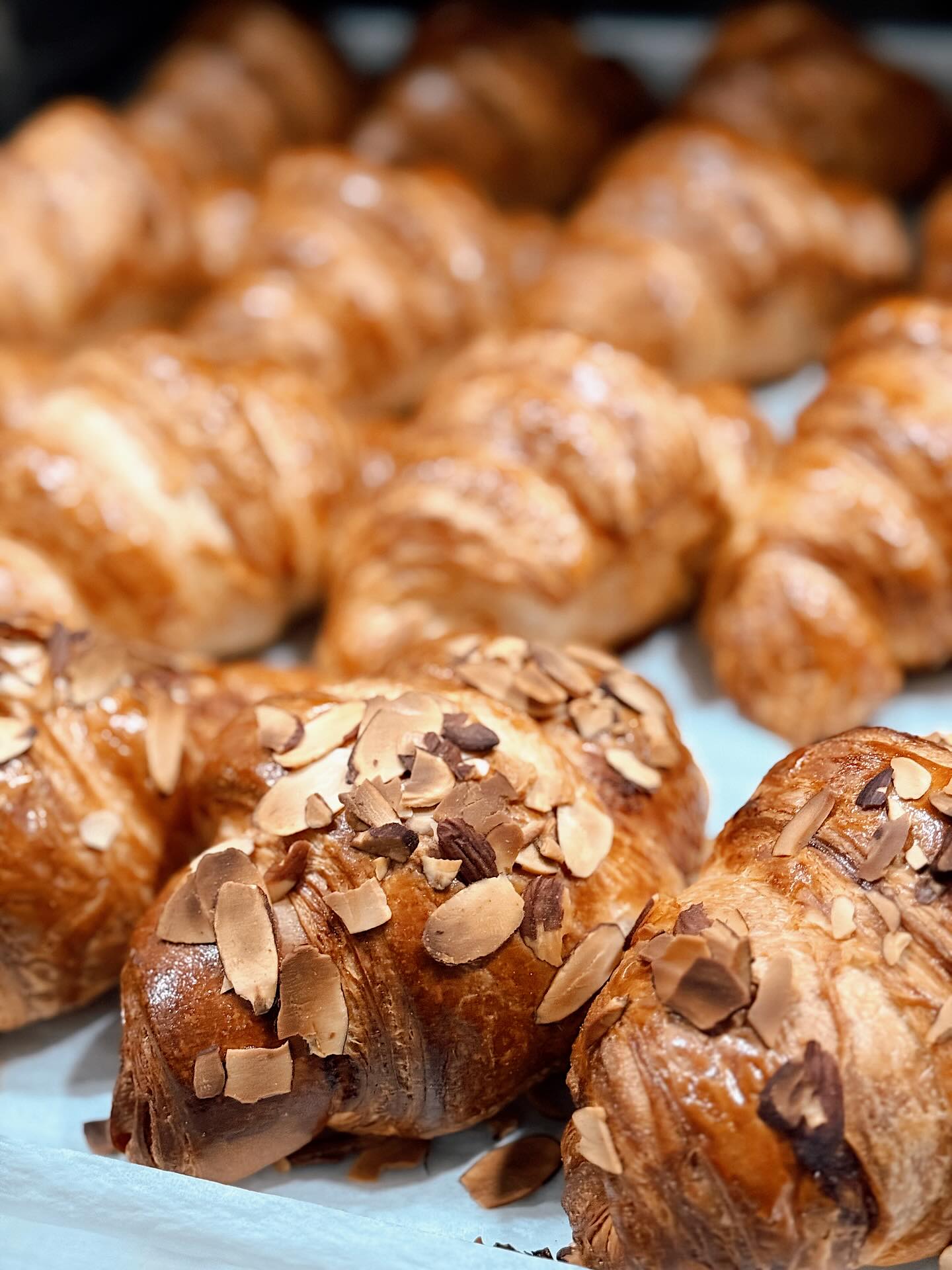 We make almond croissants a little different, we’re quirky like that.
Instead of twice baked, we thought almond croissants deserved the honor of the first-bake. We hand roll our house-made almond paste into each almond croissant and bake to golden, flaky perfection!
This way it makes it way through the layers (and not just half-baked in the center)
If you haven’t yet, give our take on this beautiful classic a try 💁🏽♀️🥐