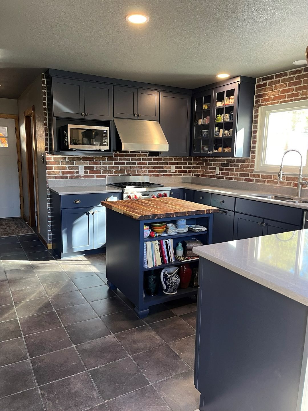Check out this Before and After transformation from our Evergreen Escape Project!
A small but statement kitchen renovation in this quaint mountain side home in the little neighborhood of Valley-Hi, Evergreen, Colorado.
Our client wanted to create an updated and moody kitchen featuring a beautiful navy paint accented with a red brick backsplash throughout. Paired with a concrete look quartz and butcher block island top.
We’re so happy how it turned out!✨
Ready to take that next step? Contact us today and let’s navigate your project together.
.
.
.
.
.
#beforenandafter #houseofeon #evergreen #coloradodesign #kitchendesign #transformation #navykitchen #coloradodesigner #interiordesign #renovation