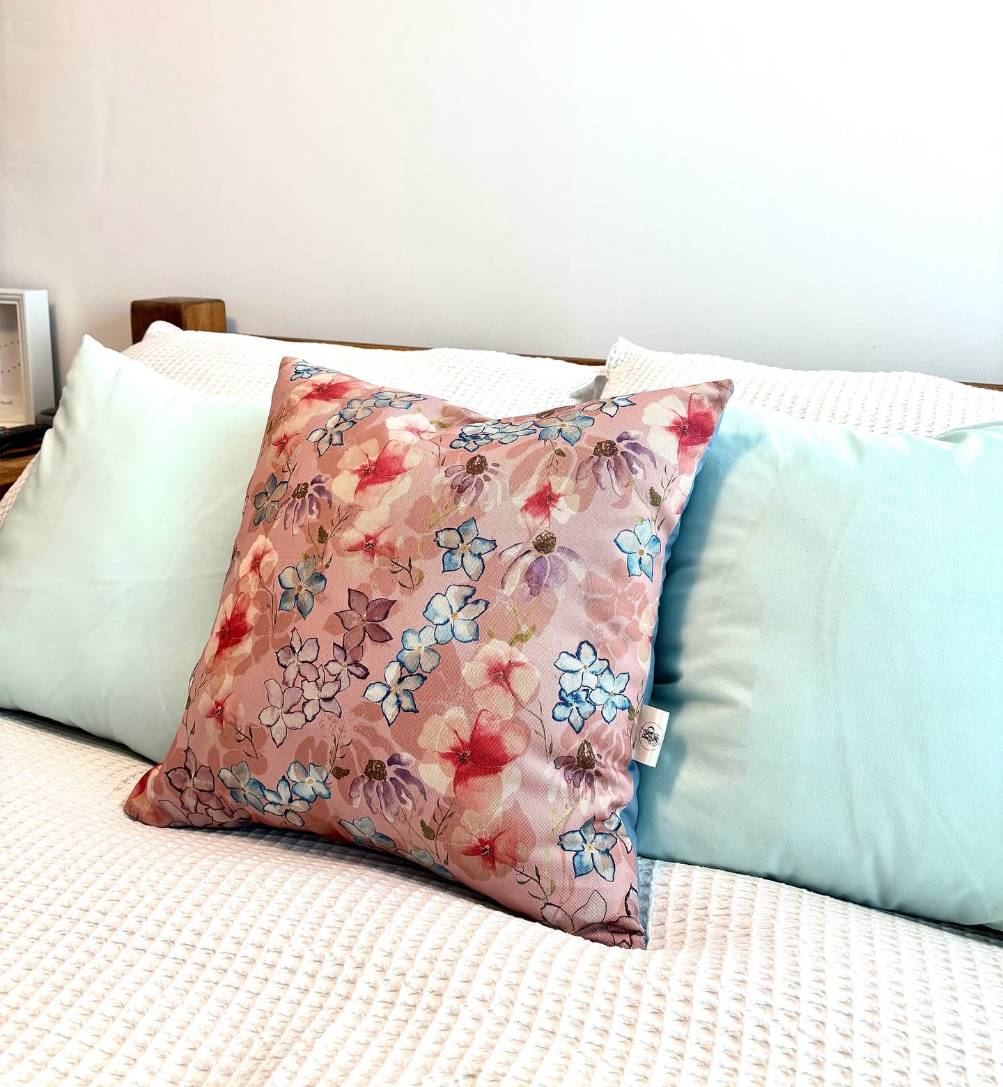 Floral Whimsy Cushion. Organic cotton twill hand designed front fabric and organic cotton dusky blue reverse fabric. #sustainable #textiles #sustainabledesign #smallbusiness #interior #cushion #sustainableinteriors #uniquedesigns #textiledesigner #handmade #handdesigned #organiccottonfabric