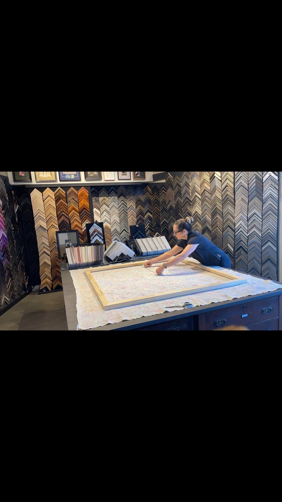 Working on a 55”X55” Mexican tapestry. An hour into one minute. #embroidery #canvasstretching #norwoodma #floaterframe #frameshop #customartframing #colorfulart #mexicanart #larsonjuhl #birds #flowers #shopsmall #timelapse
