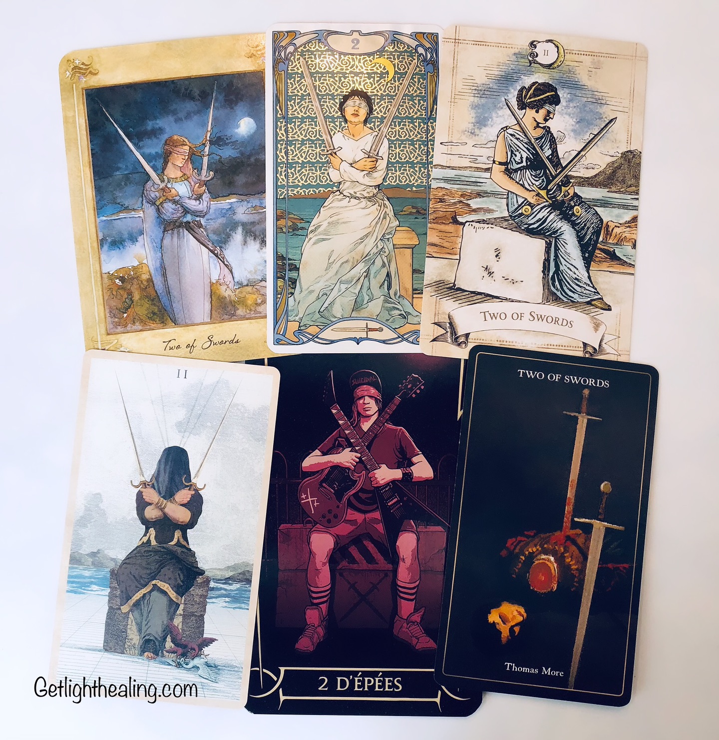 Guidance for June 15, 2025: 2 of Swords: “Divided Thoughts”
#llewellyntarot shows the barriers we put up between ourselves & the external world to preserve our peace. Moon in Libra strives for emotional equilibrium. We deny our true feelings, unsure how to act. Frozen in confusion we close off our heart.
#goldenartnouveautarot Golden Art finds a blindfolded woman with her swords raised in a defensive manner. Fragile peace is found but only because she chooses not to know. While she would rather avoid this unpleasantness altogether, ignoring the truth, as heavy as those swords, can only be sustained for so long.
#oldstyletarot shows a woman sitting on a stone seat emphasizing the uncomfortable nature of the pending choice & how it must be done cold. A decision made thru cold cognition is more likely to involve logic and critical analysis, but her eyes are covered, signaling it’s not an informed choice. She’s then forced to blindly yet cautiously feel her way through.
#terravolatiletarot features a completely hooded woman with two birds wresting at her feet-the internal fight between adjustment & balance. There’s active thought & consideration going on even though it does not appear so. The agitated waters suggest decision making will involve an emotional element -an uneasy one made with limited information.
#tarotmetal shows Mike Muir from the crossover thrash group Suicidal Tendencies with two guitars crossed across his heart symbolizing his divided loyalties between thrash metal & hardcore punk. Wearing his trademark bandana, he found a compromise between two worthy allies, by making a change from punk to metal, thus creating what would become crossover thrash.
#magiciansmartyrsandmadmentarot we see a beheaded Thomas More representing courage & friendship & finding (or not) agreement in a situation of conflict. A devoted Catholic, he found himself caught between his allegiances to his faith & his employment to the King, who was amid breaking England from the Catholic Church. Canonized as a saint for his courageous choice to stay true to his faith.