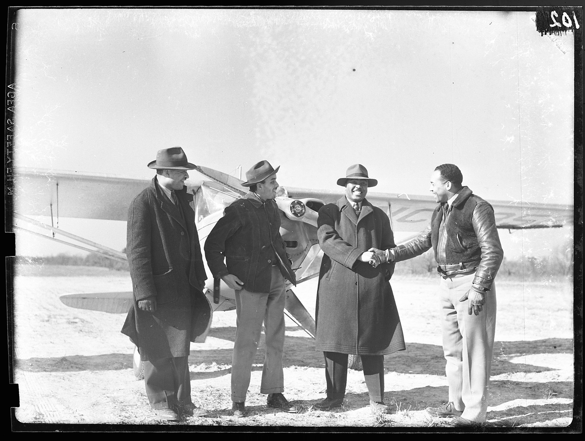 Colleagues at The People’s Archive at the @dcpubliclibrary recently shared a never-before-seen (to us!) photo they discovered from the DC photographer Edward Fetcher’s collection: jazz saxophonist and big band leader Jimmy Lunceford is shaking hands with Columbia Air Center manager John Greene, with other members of the DC-based Cloud Club. We know that Lunceford would fly into the Columbia Air Center, and that he even got his bandmates to help construct some of the airplane hangars there!