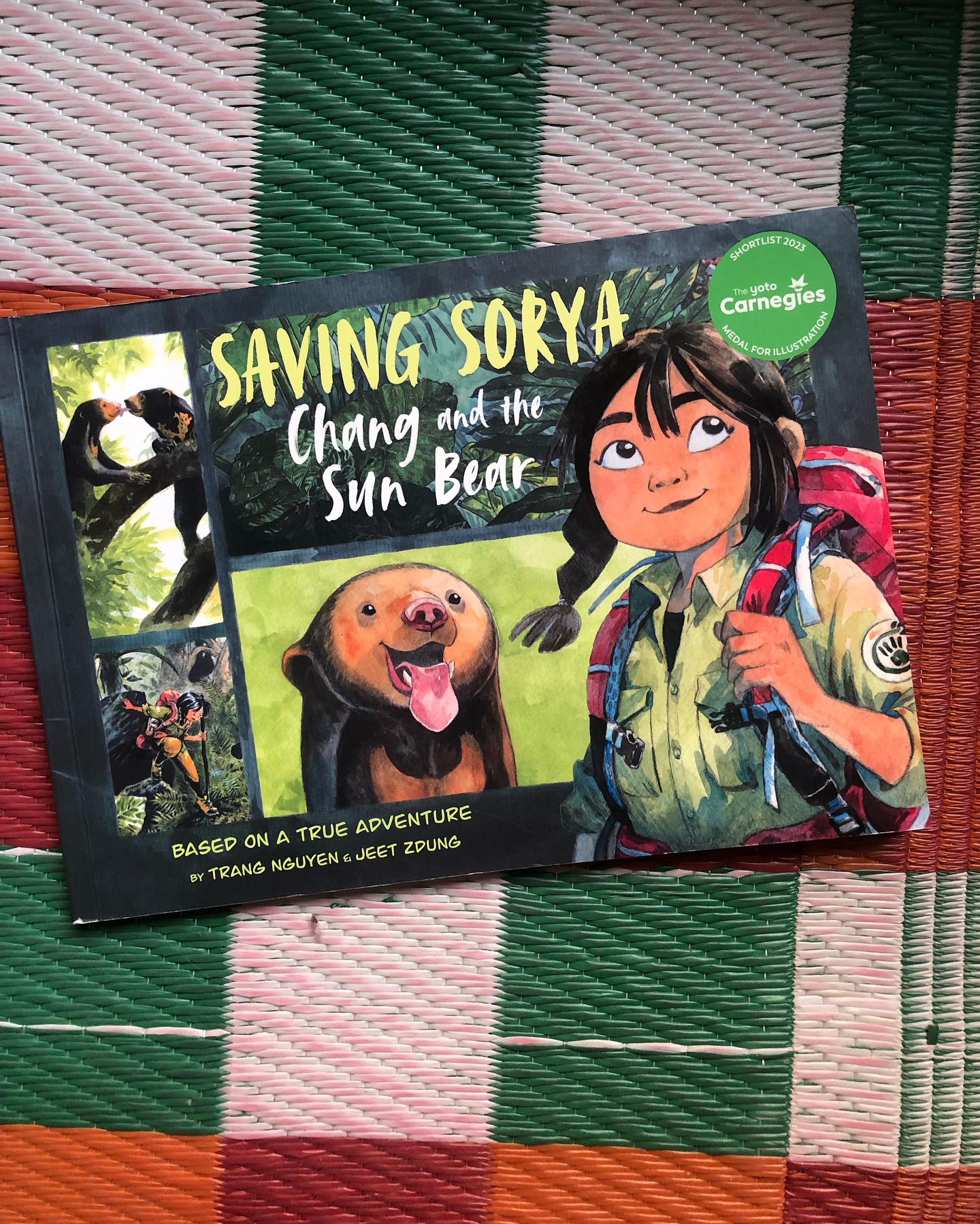 Saving Sorya: Chang and the Sun Bear
By Trang Nguyễn; Illustrated by Jeet Zdũng
This powerful story follows Chang, whose life takes an unexpected turn after witnessing the horrors of bear bile extraction. That moment becomes the catalyst for her journey into wildlife conservation. Against all odds, Chang joins Free the Bears and soon meets Sorya- a Sun Bear cub born in captivity, with no understanding of the wild he was meant to live in.
Sorya has never roamed free, never foraged for food, never faced the dangers- or wonders- of the forest. It becomes Chang’s mission to help him reclaim the life he was never given: to survive, thrive, and eventually return to the wild.
This breathtaking graphic novel is filled with exquisitely detailed illustrations- each frame a work of art. The story is deeply moving, especially the final moments between Chang and Sorya, which are tender, bittersweet, and quietly heart-wrenching.
Told almost like a personal journal, the story blends heartfelt text with rich visual storytelling, offering a layered reading experience. It’s a fictionalised narrative based on true life.
Ideal for ages 6+